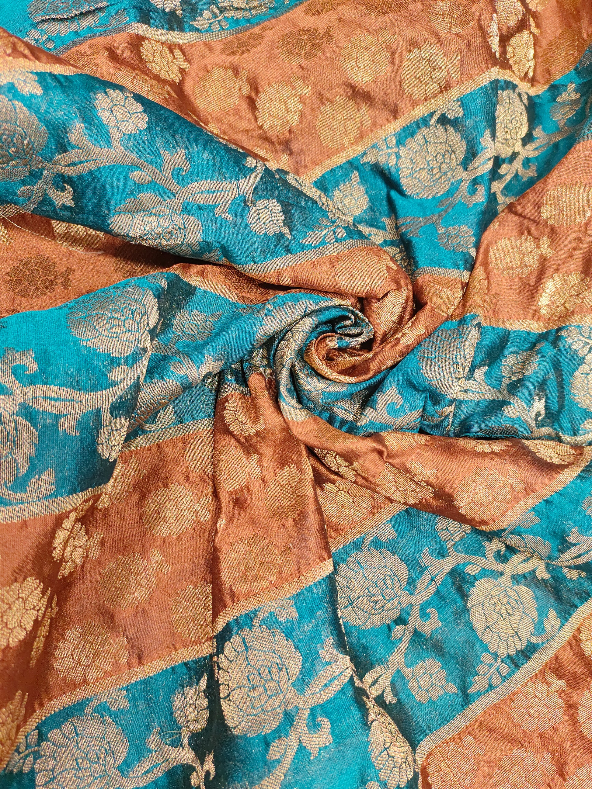 Banarasi stripe fabric with peacock blue and brown with rust weave
