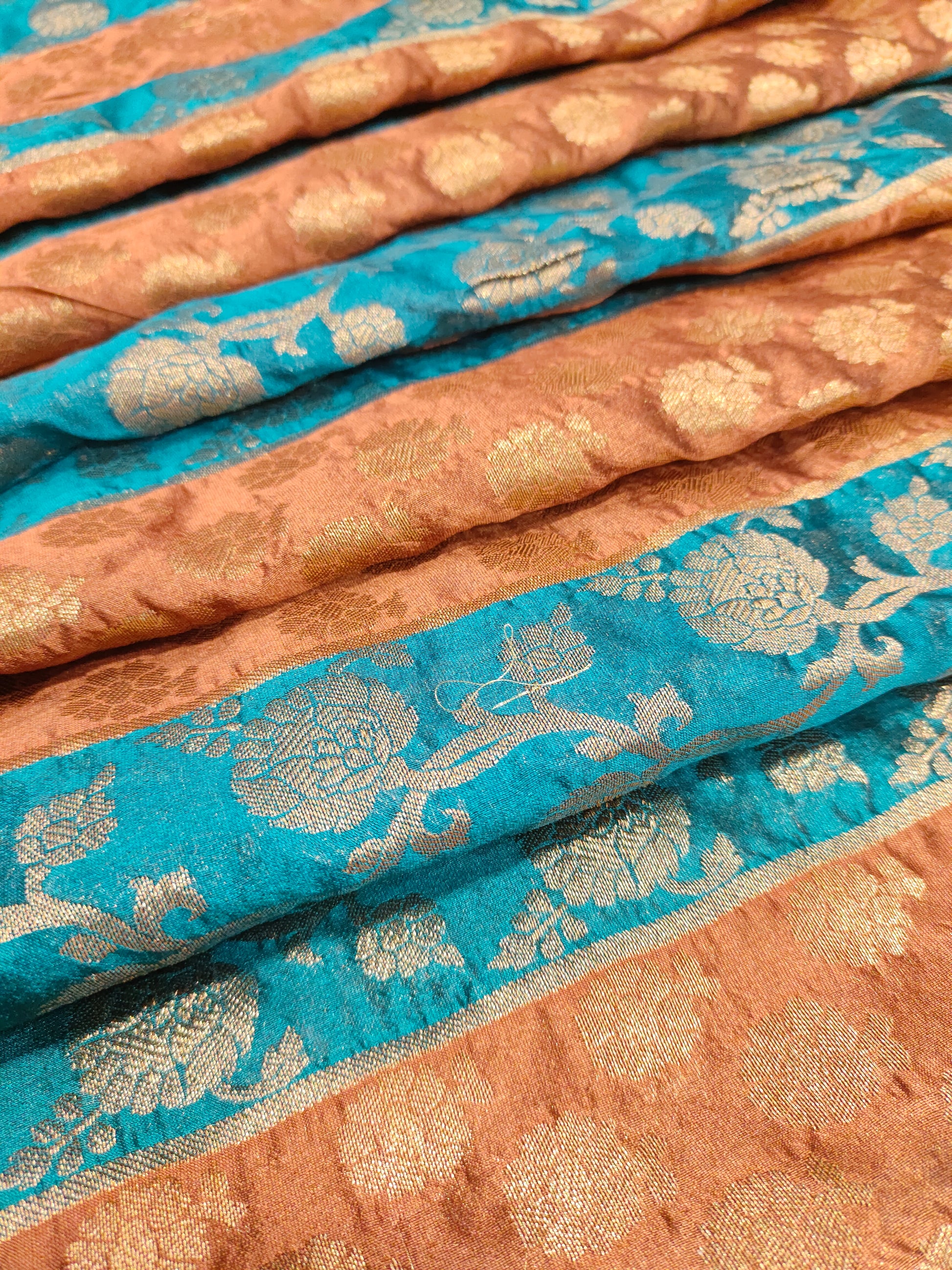 Banarasi stripe fabric with peacock blue and brown with rust weave