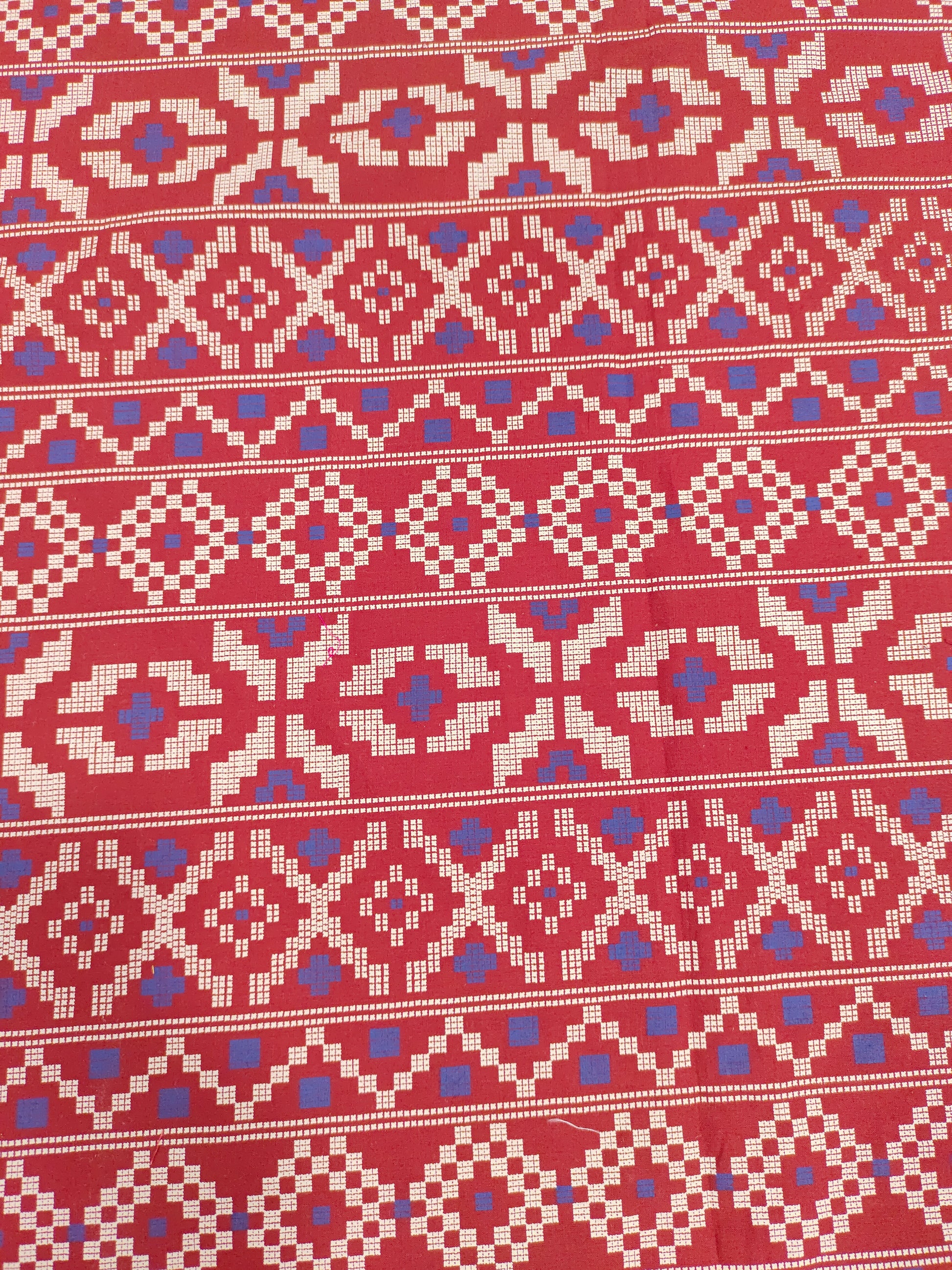 Maroon cotton fabric with blue and off white print