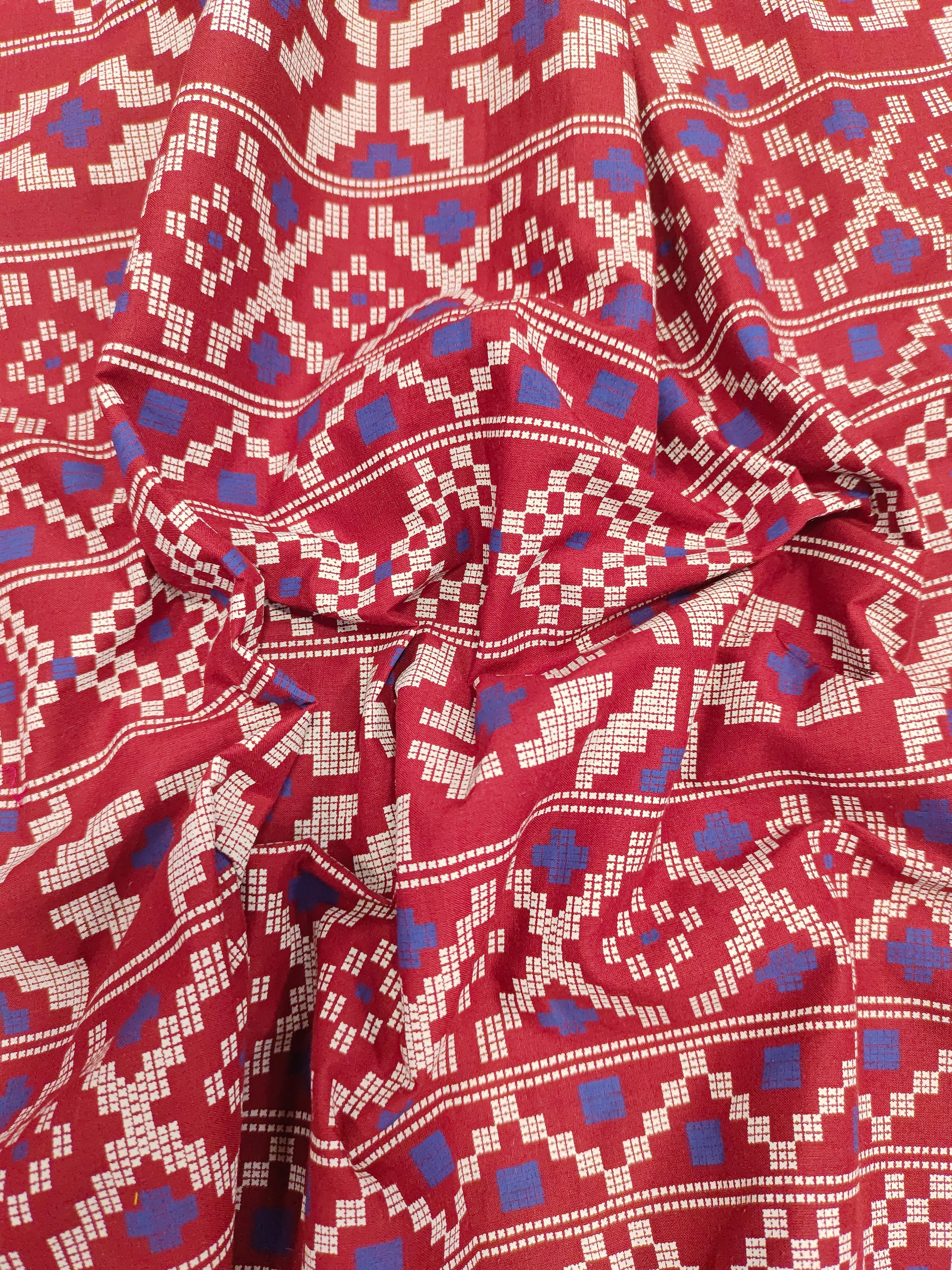 Maroon cotton fabric with blue and off white print