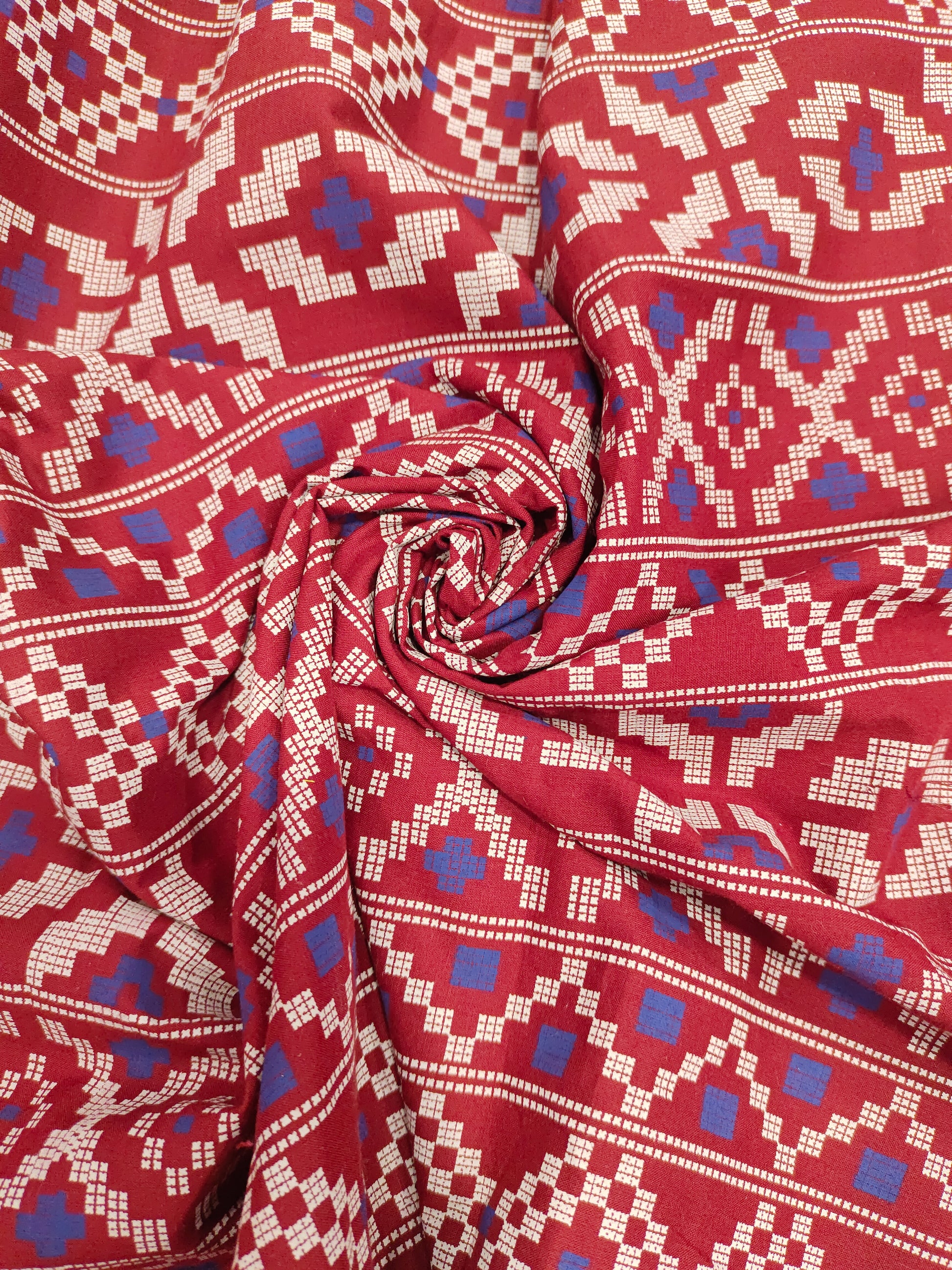 Maroon cotton fabric with blue and off white print