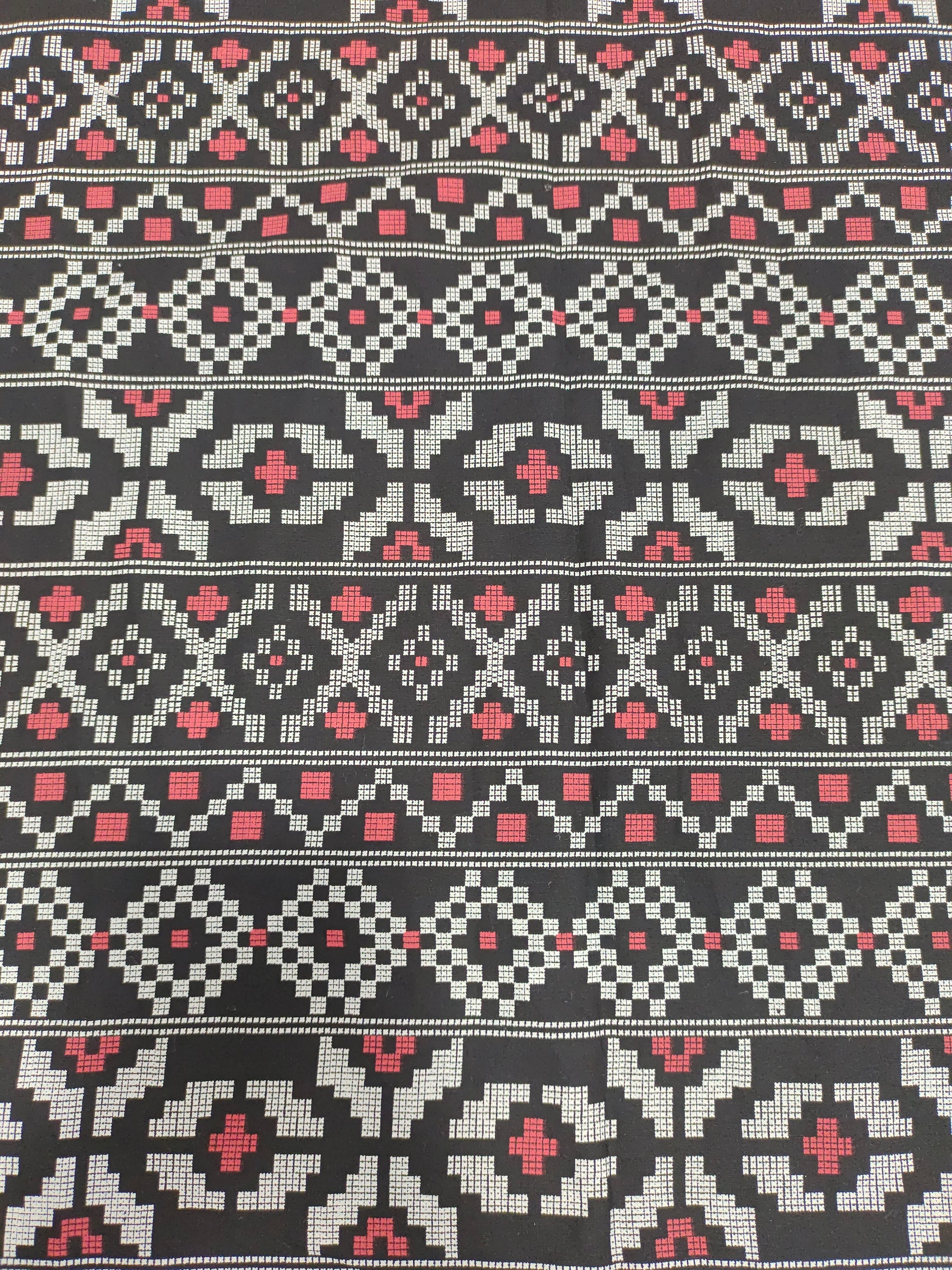 Black cotton fabric with off white and maroon print