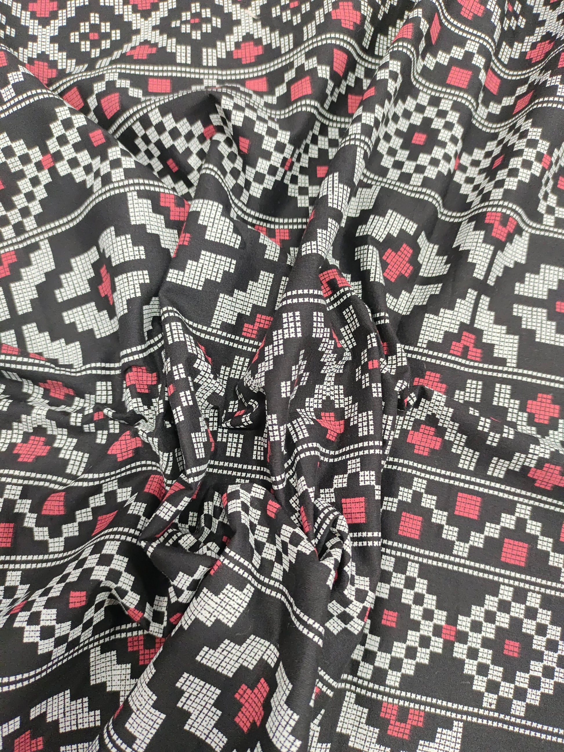 Black cotton fabric with off white and maroon print