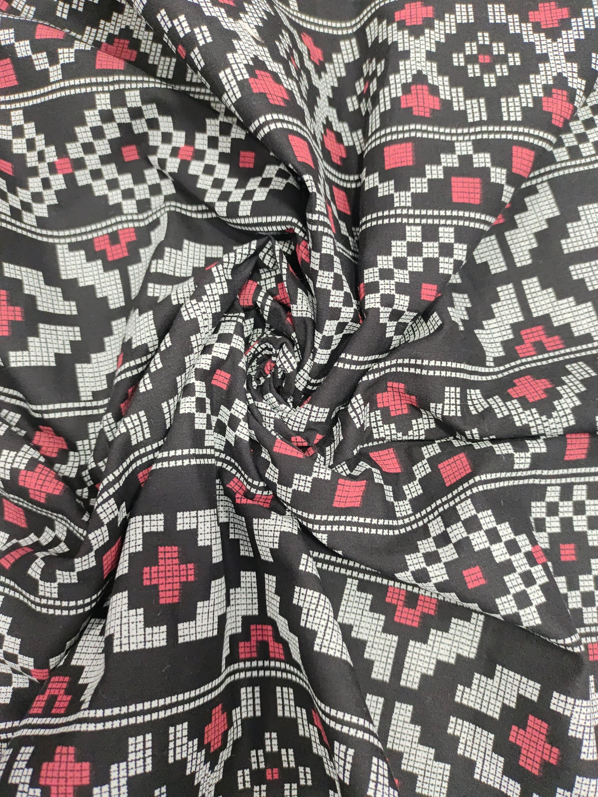 Black cotton fabric with off white and maroon print