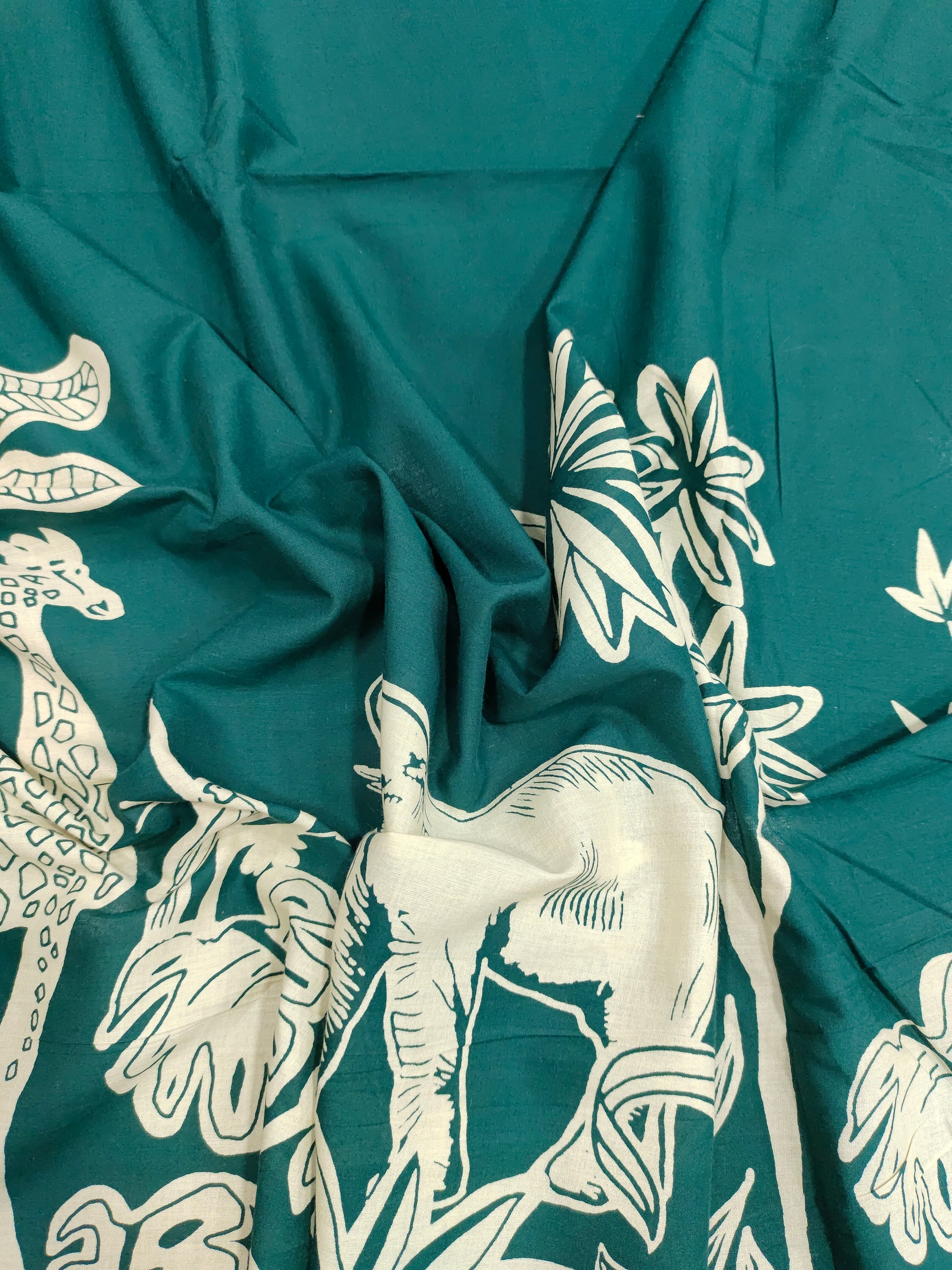 Jaipur cotton daman print on bottle green fabric