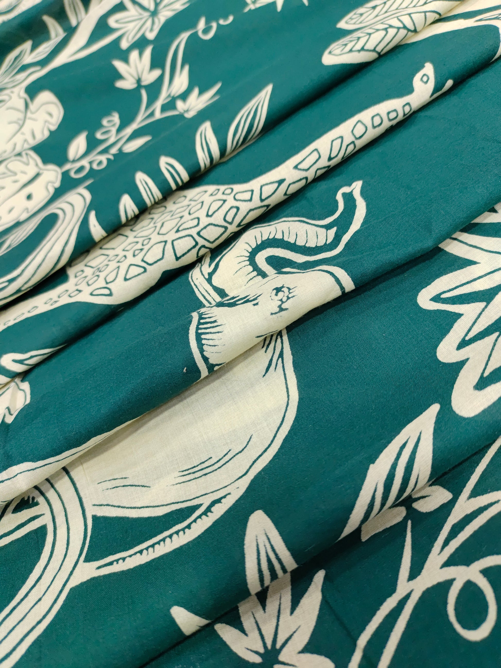 Jaipur cotton daman print on bottle green fabric