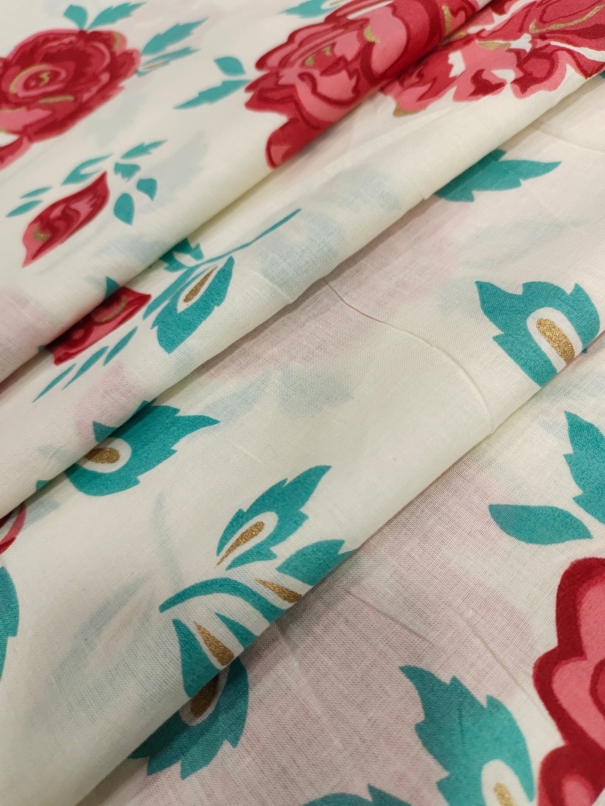 Off white base with red roses with all over