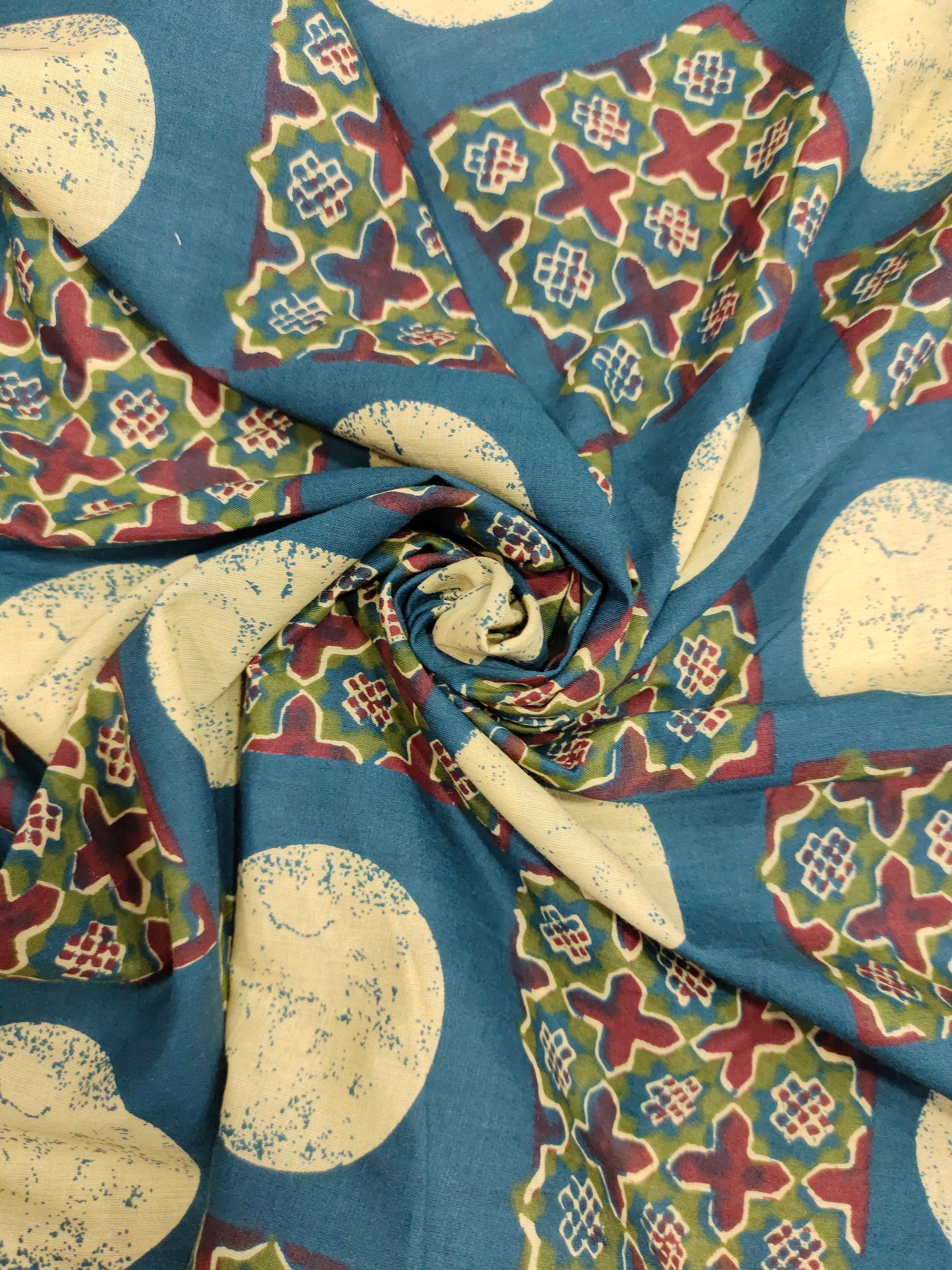 Cotton screen print blue fabric with maroon green and off white