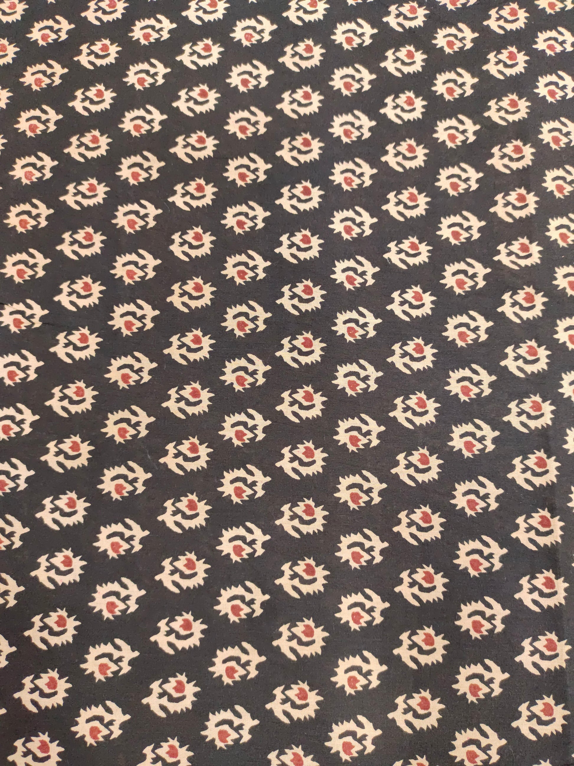 cotton fabric black with beige & rust motifs