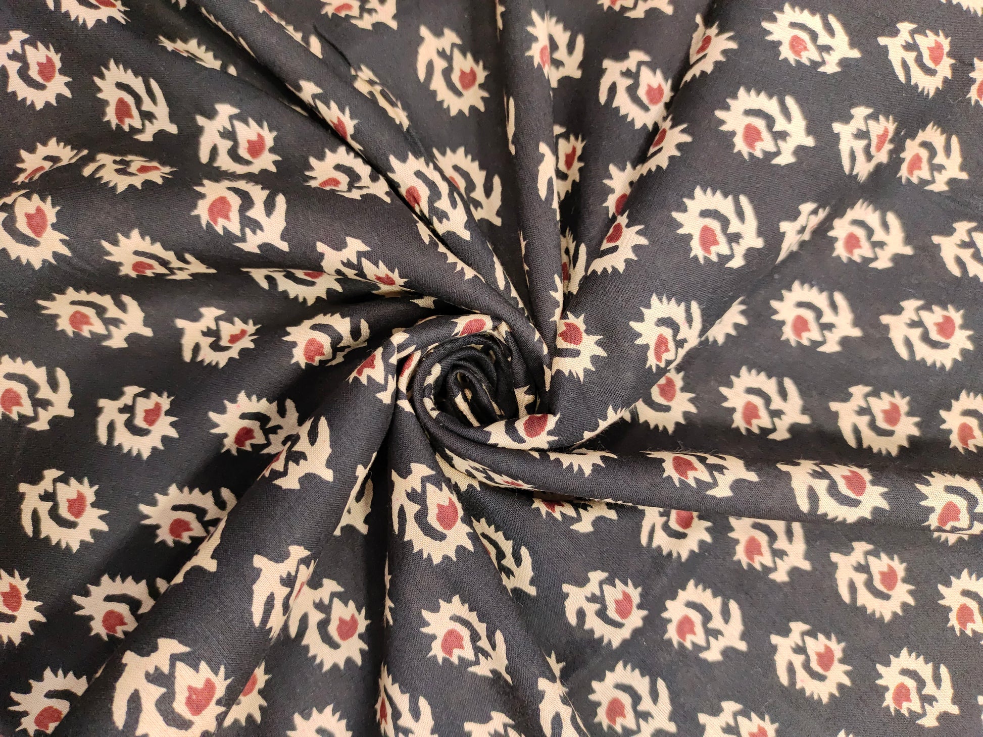 cotton fabric black with beige & rust motifs