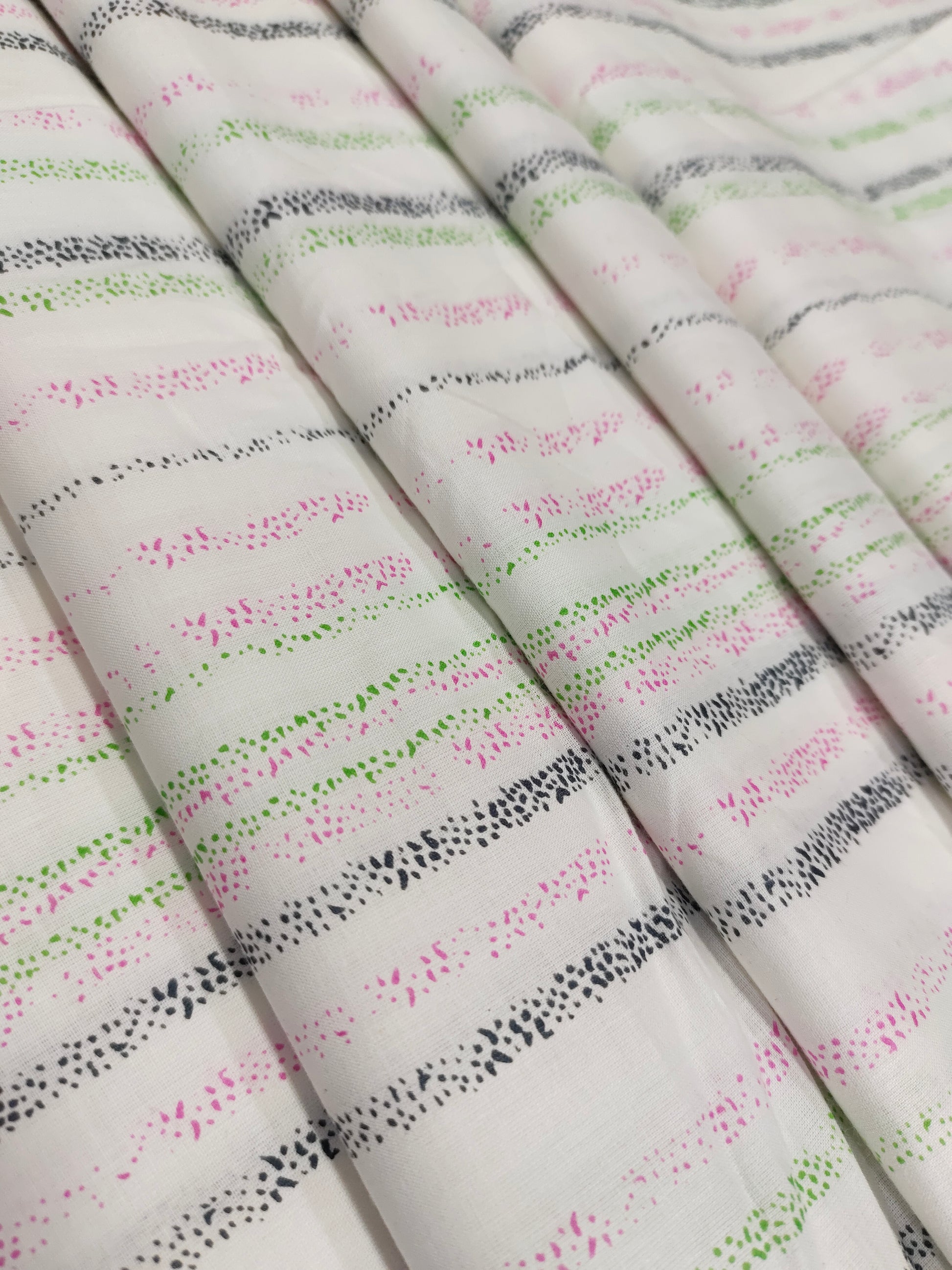 White cotton stripes with pink black green hand block print.