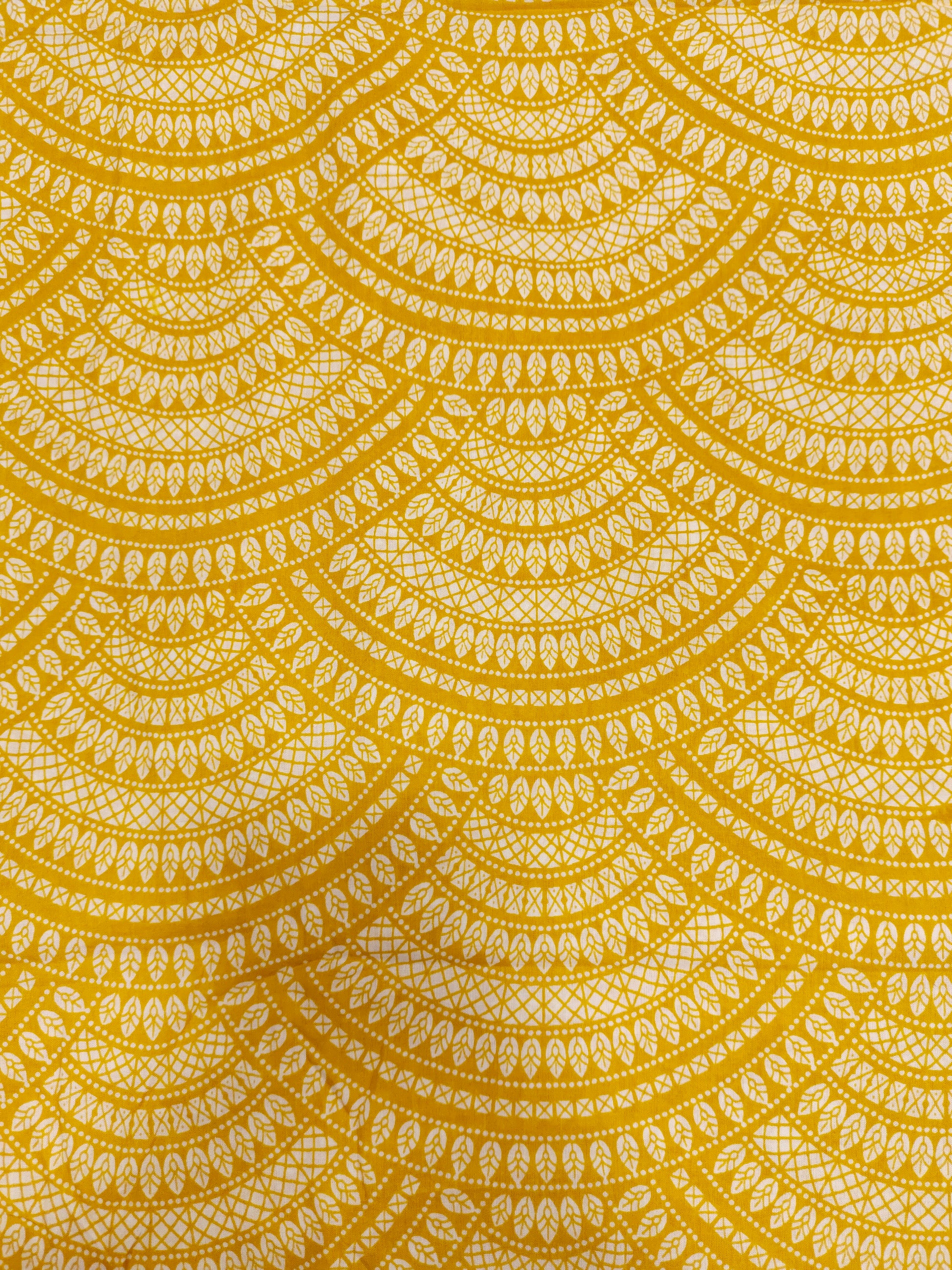 Yellow cotton half circular print.