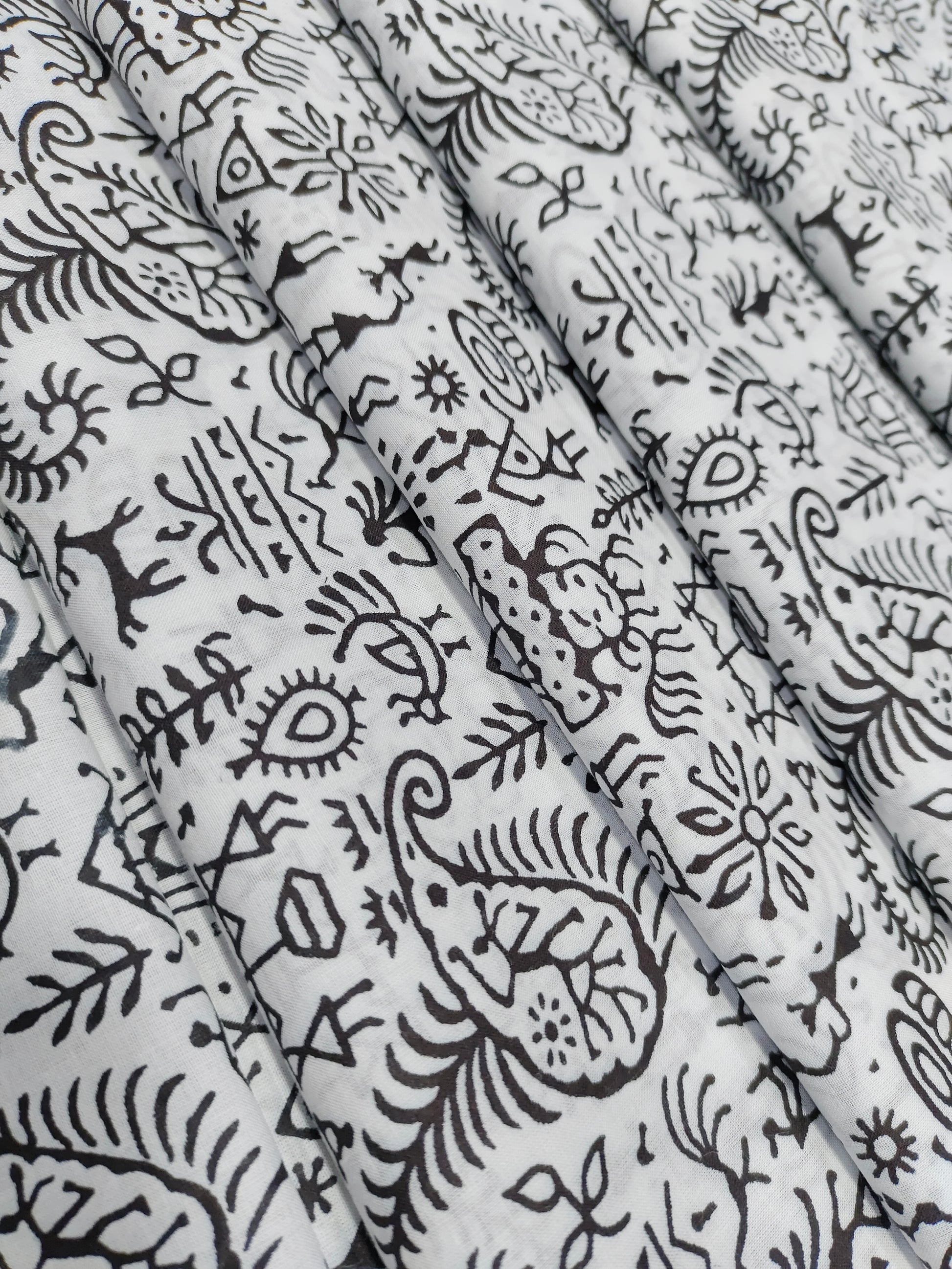 White and black allover screen print.