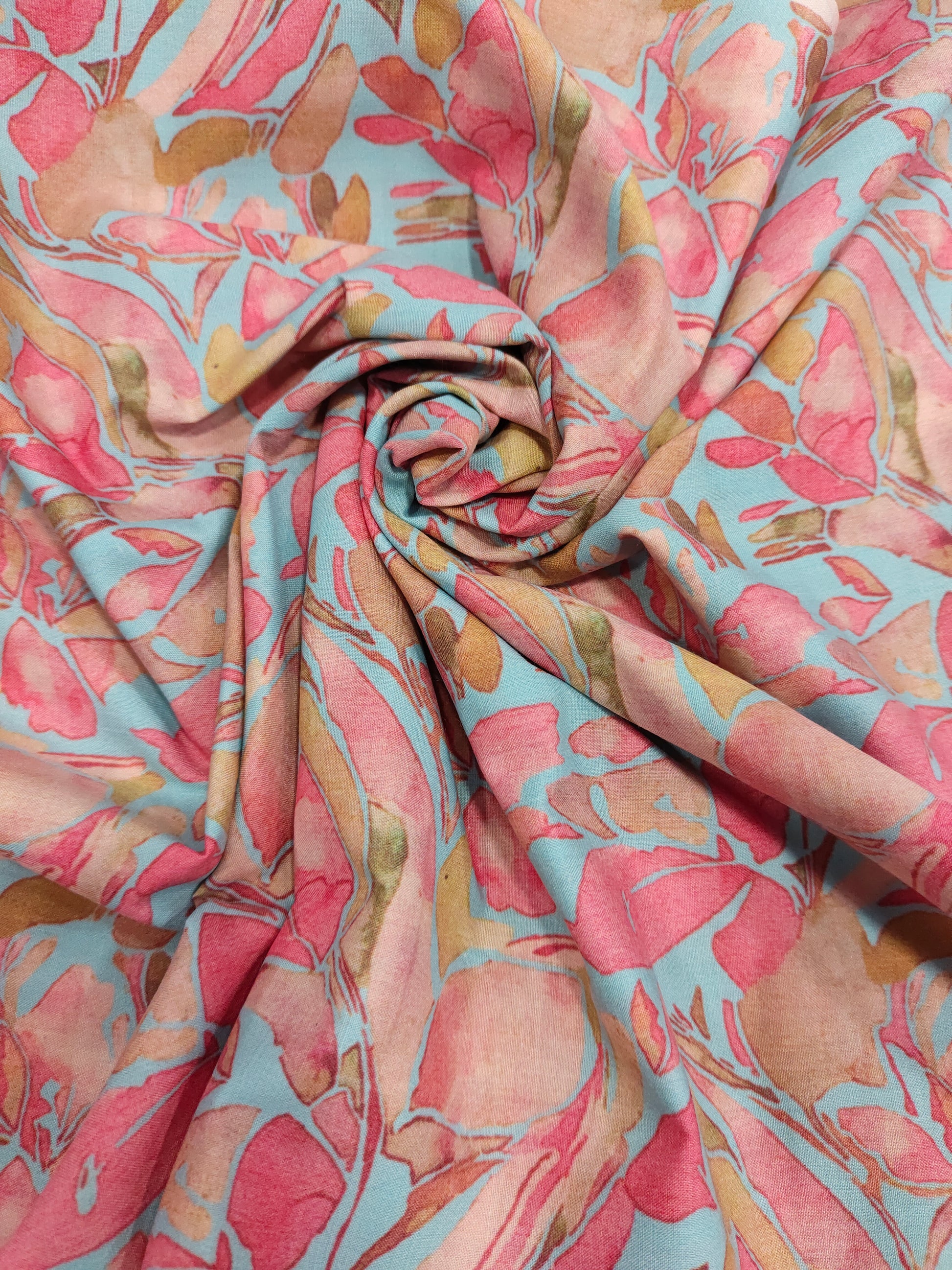 Cotton digital print on blueish green fabric withtomato and peach color.