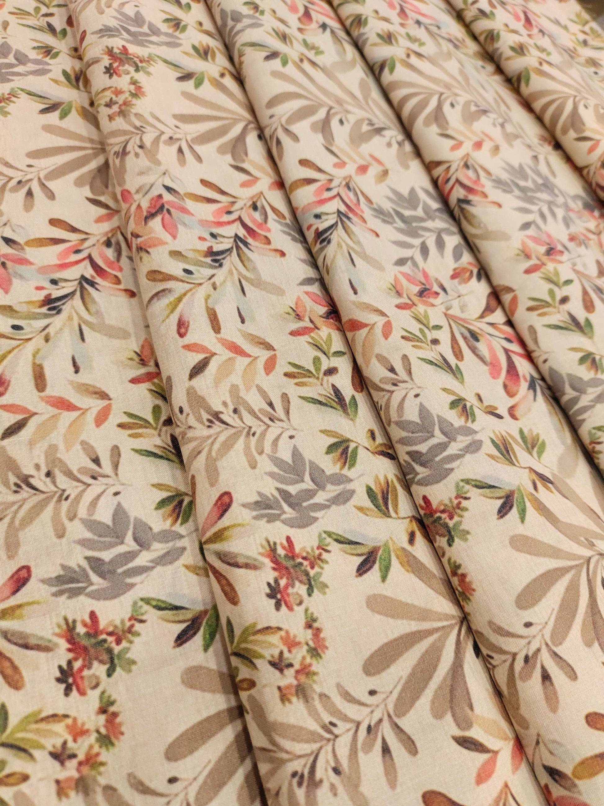 Beige cotton digital print with red light brown and grey.