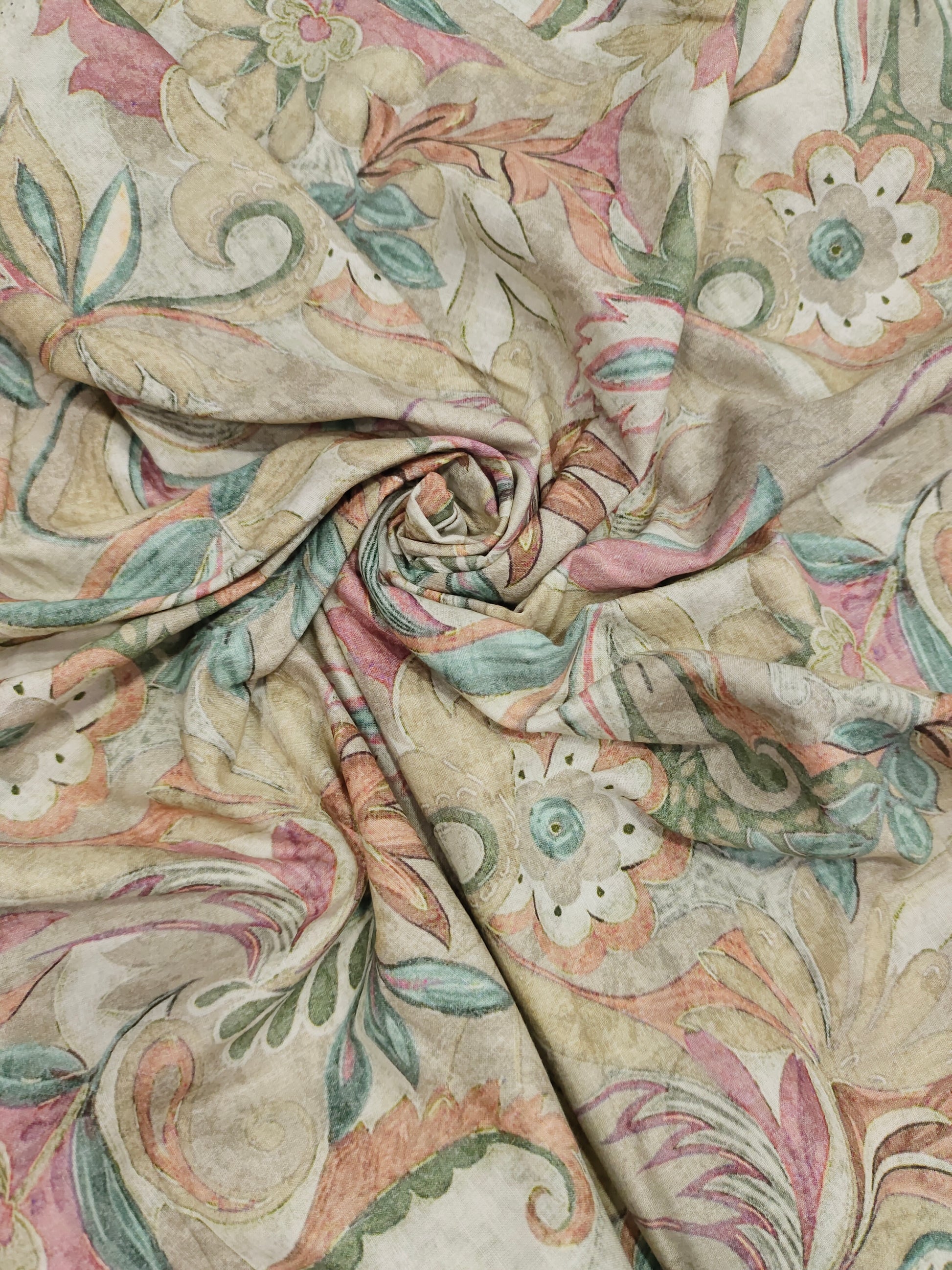 Cotton digital printed fabric with floral colors of pink green and beige.