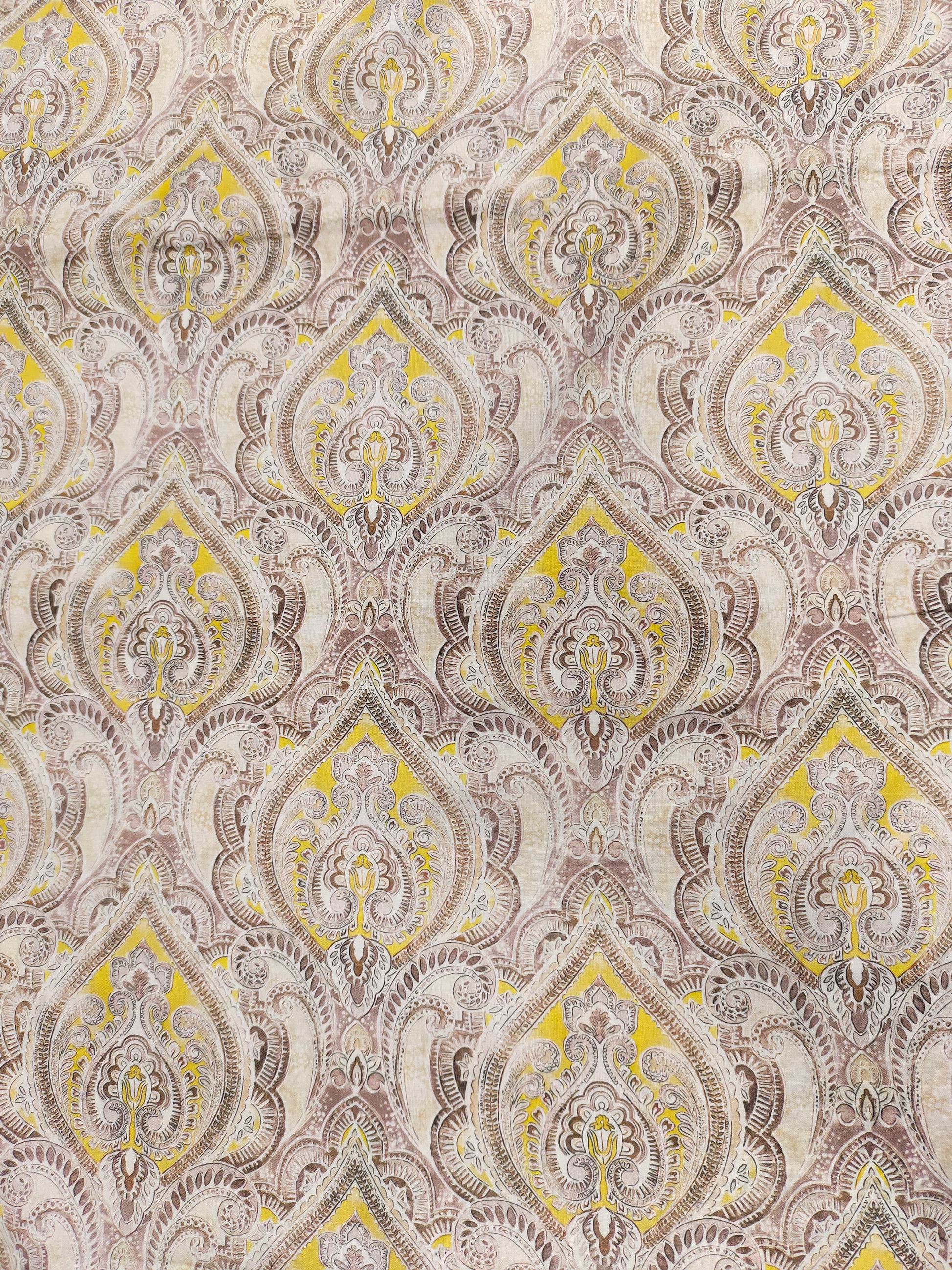 Pure cotton digital print with yellow and brown leaves pattern.