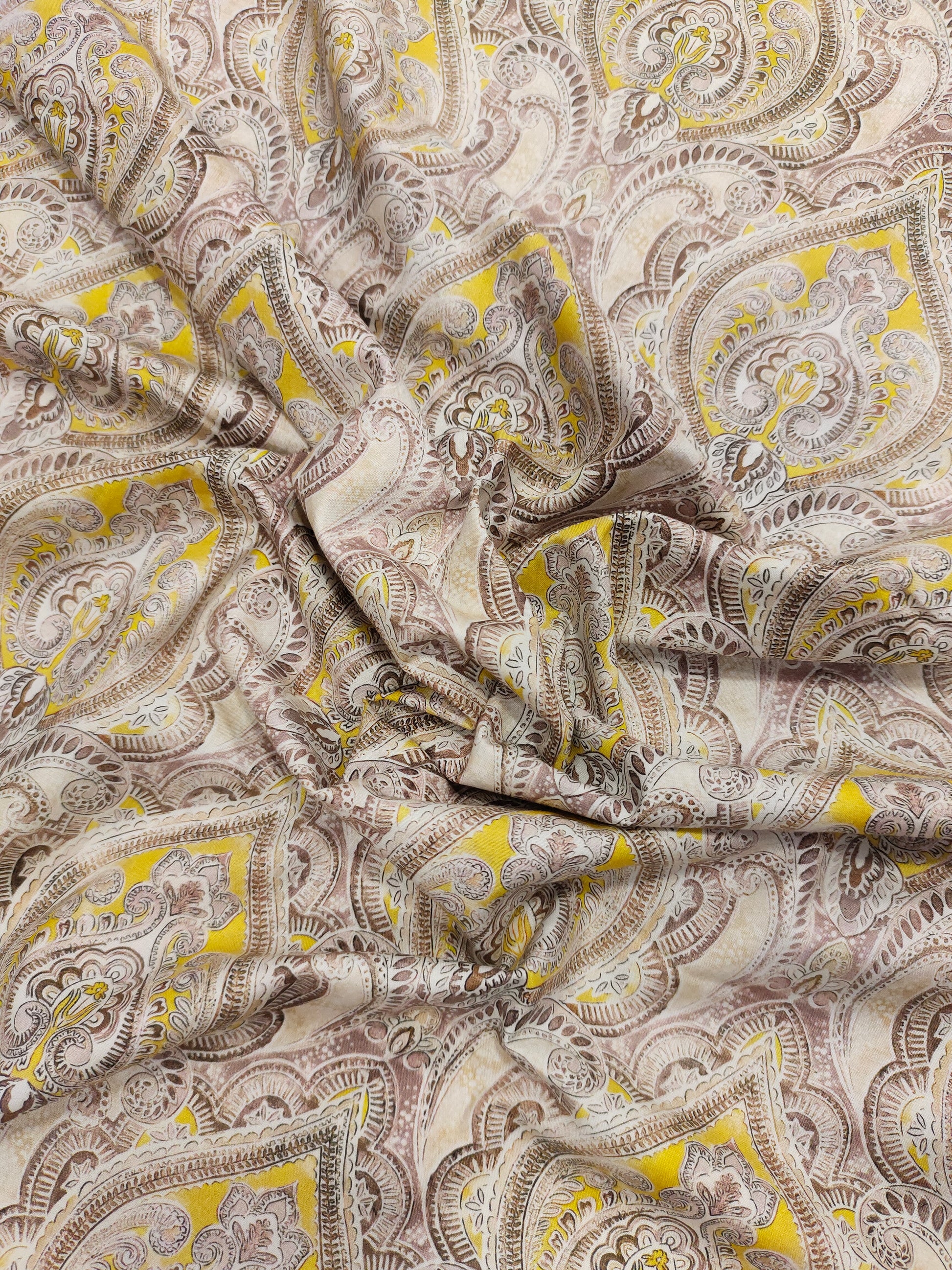 Pure cotton digital print with yellow and brown leaves pattern.