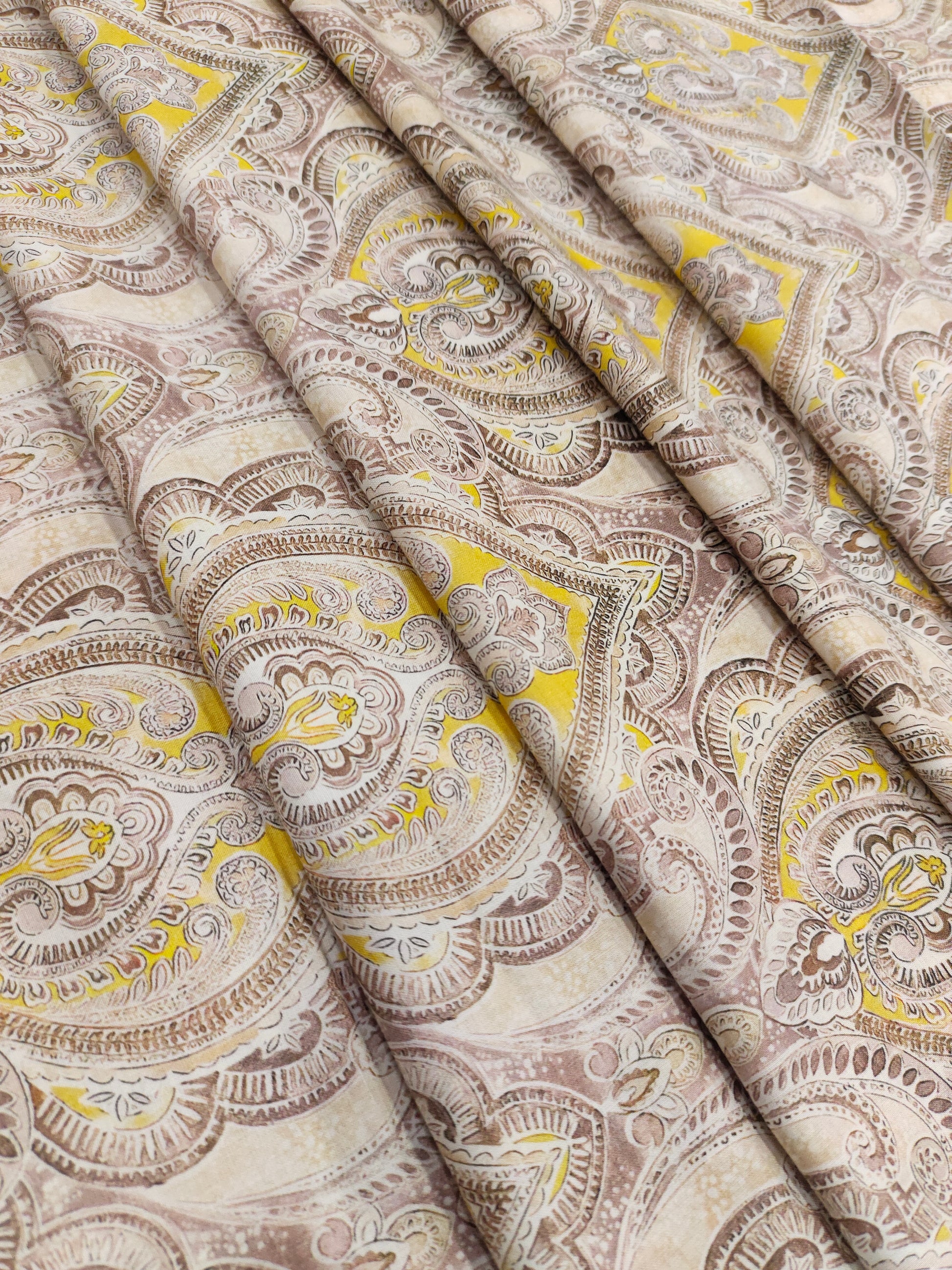 Pure cotton digital print with yellow and brown leaves pattern.