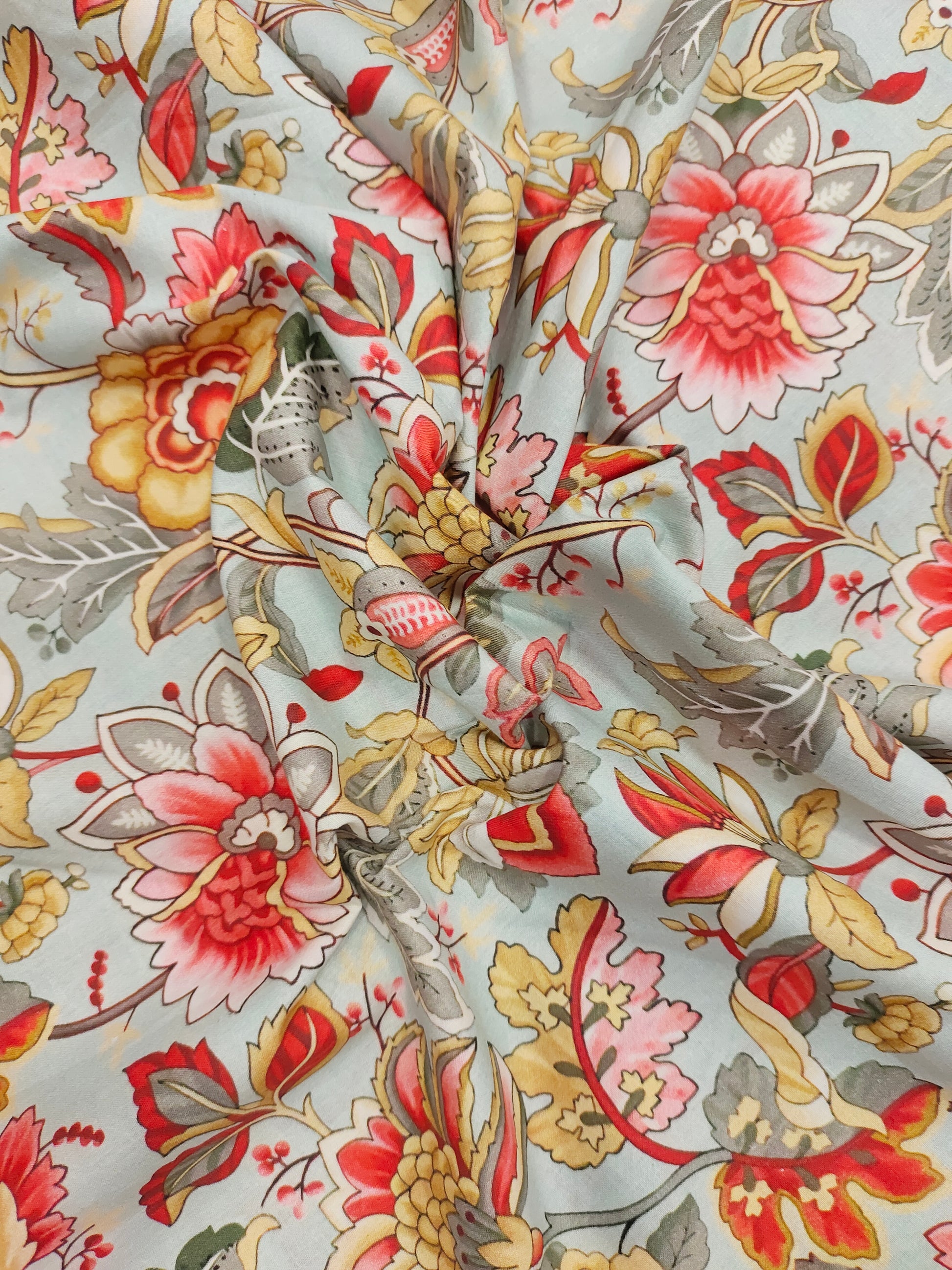 Cotton digital print with red beige and grey.