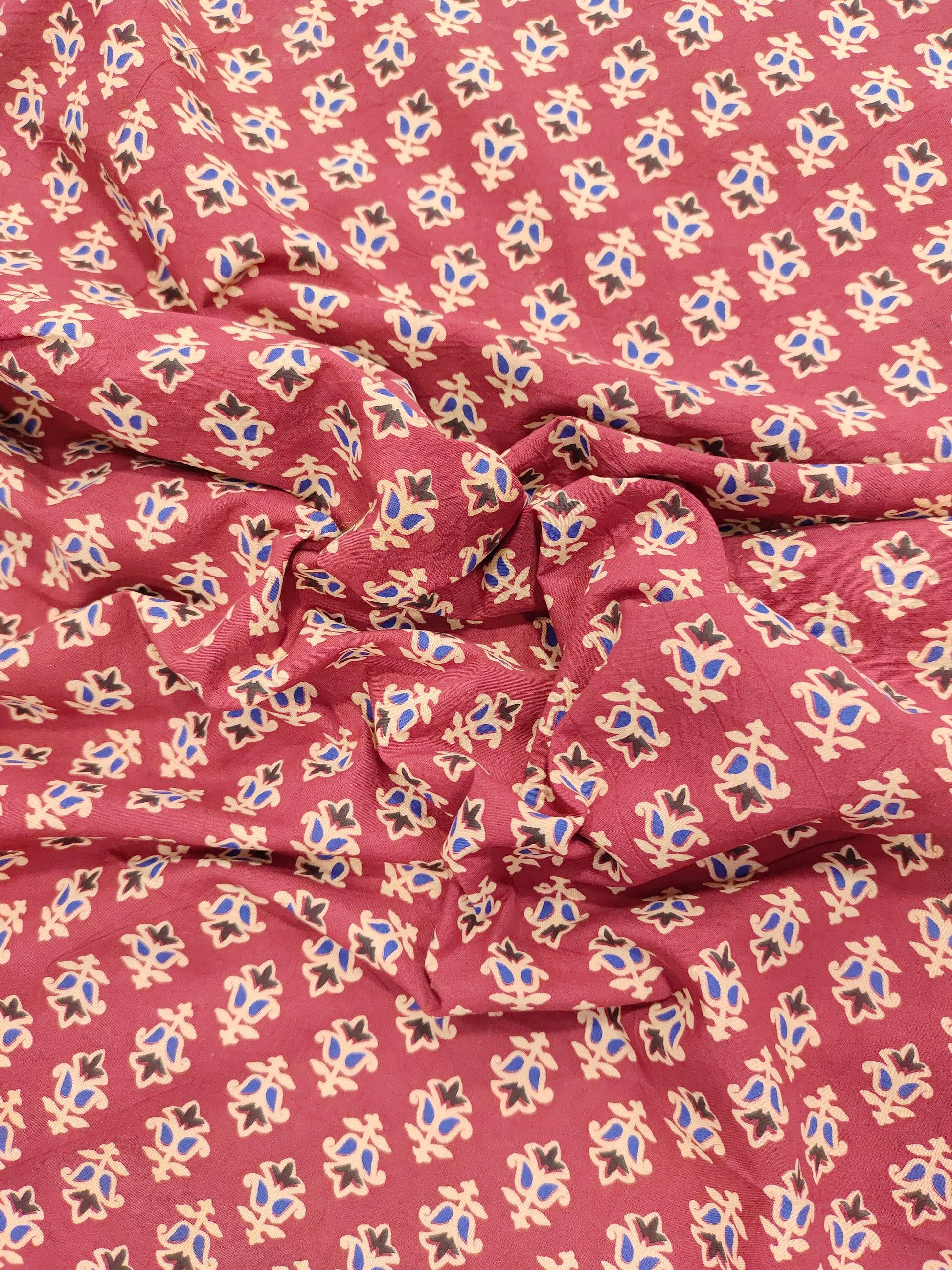 Maroon base cotton small ajrak butti fabric.