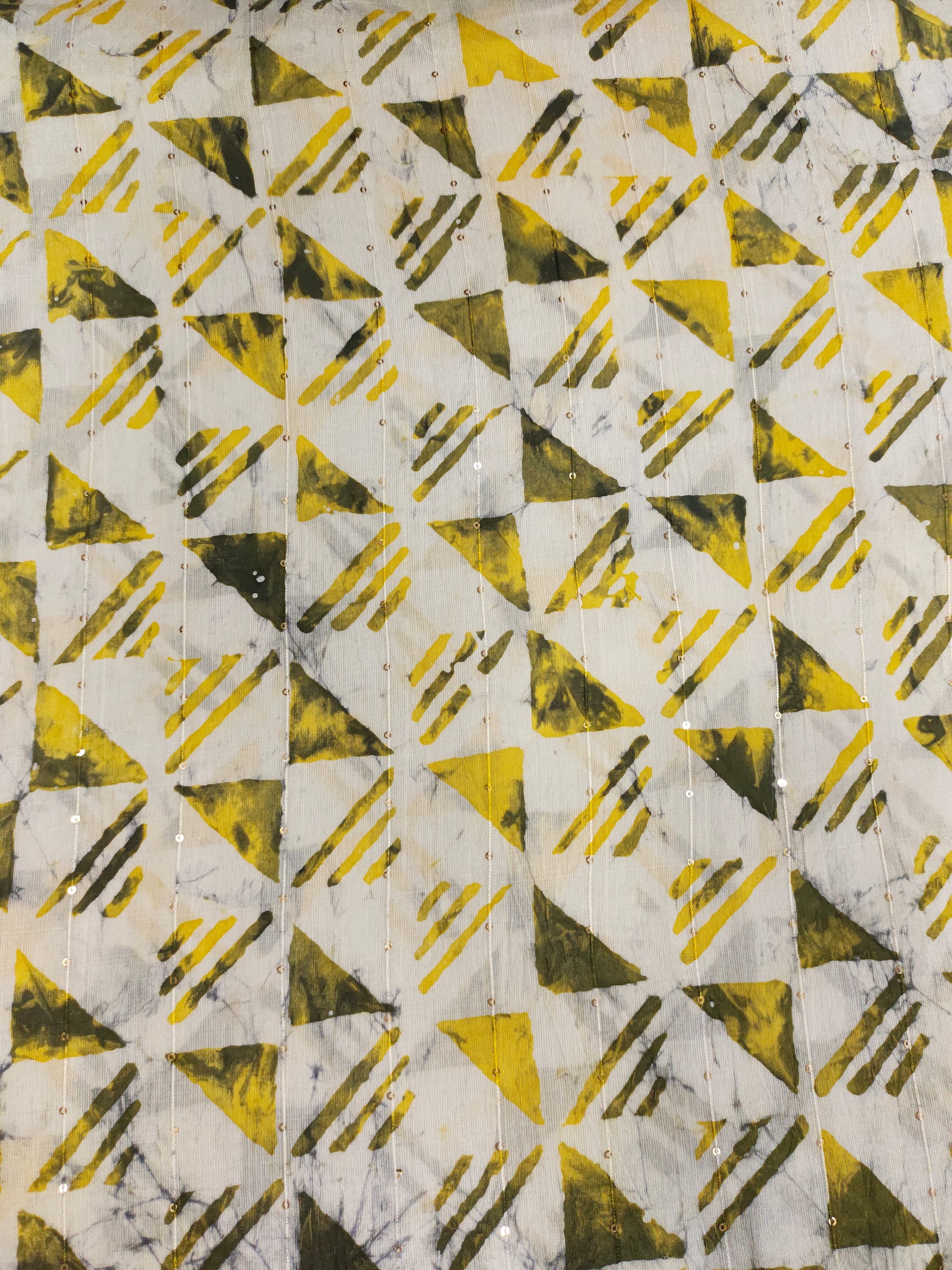 Chanderi silk batiq print with yellow and green.