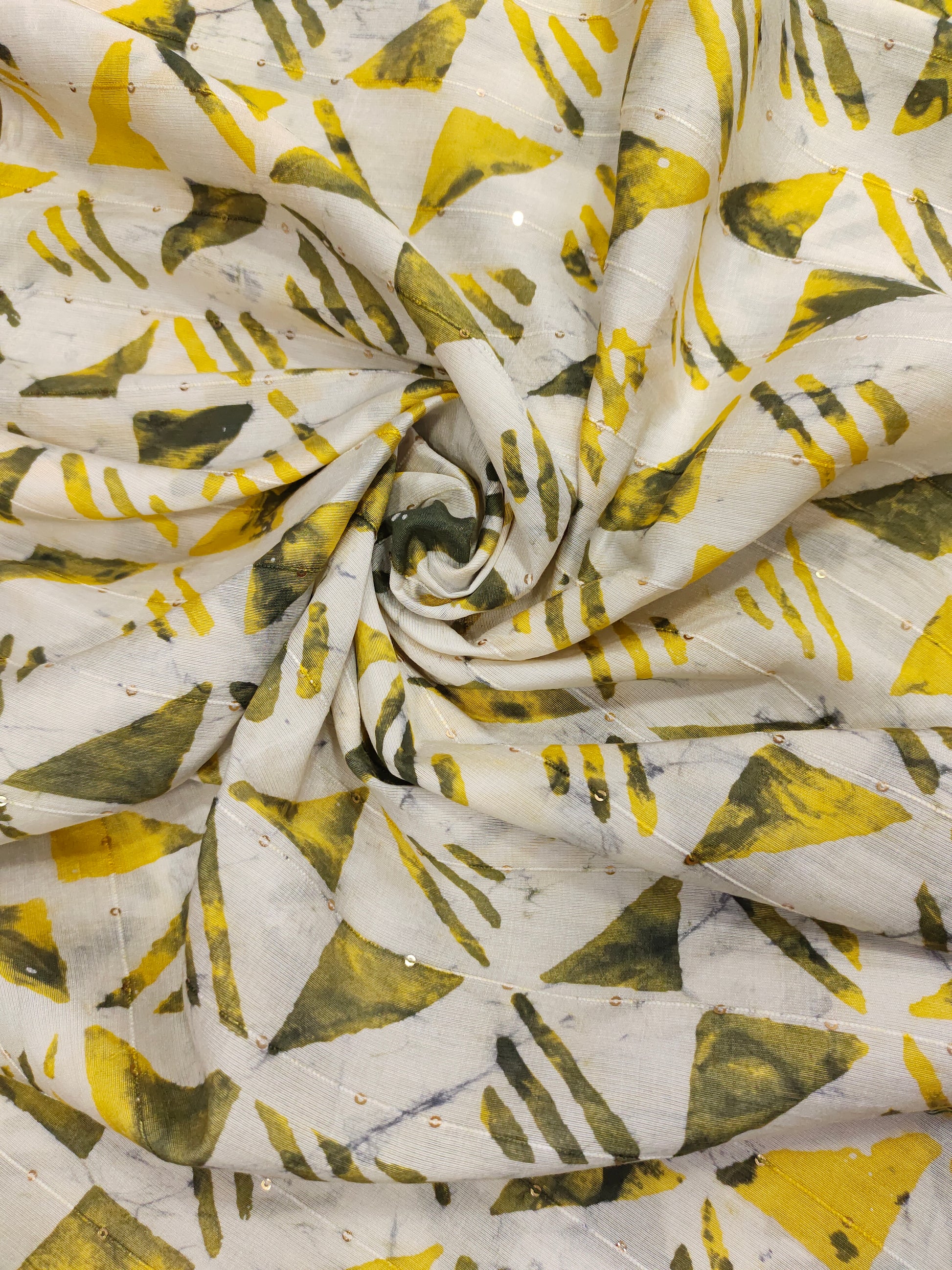 Chanderi silk batiq print with yellow and green.
