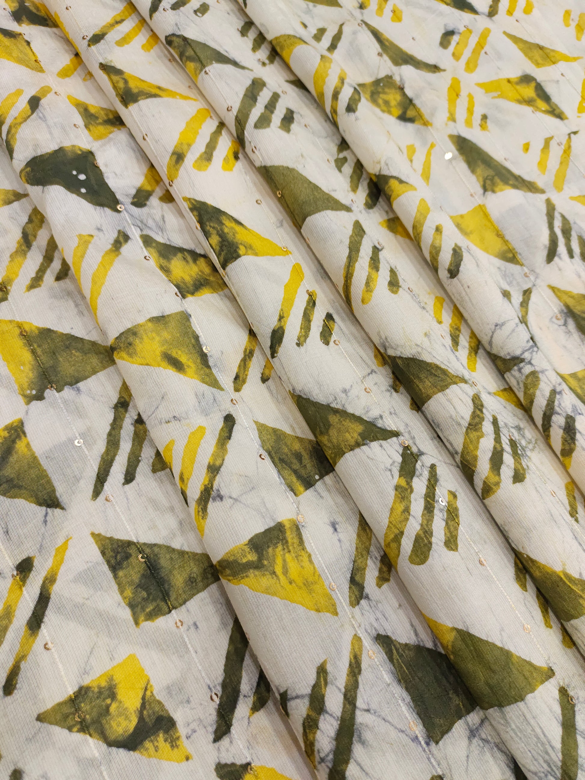 Chanderi silk batiq print with yellow and green.