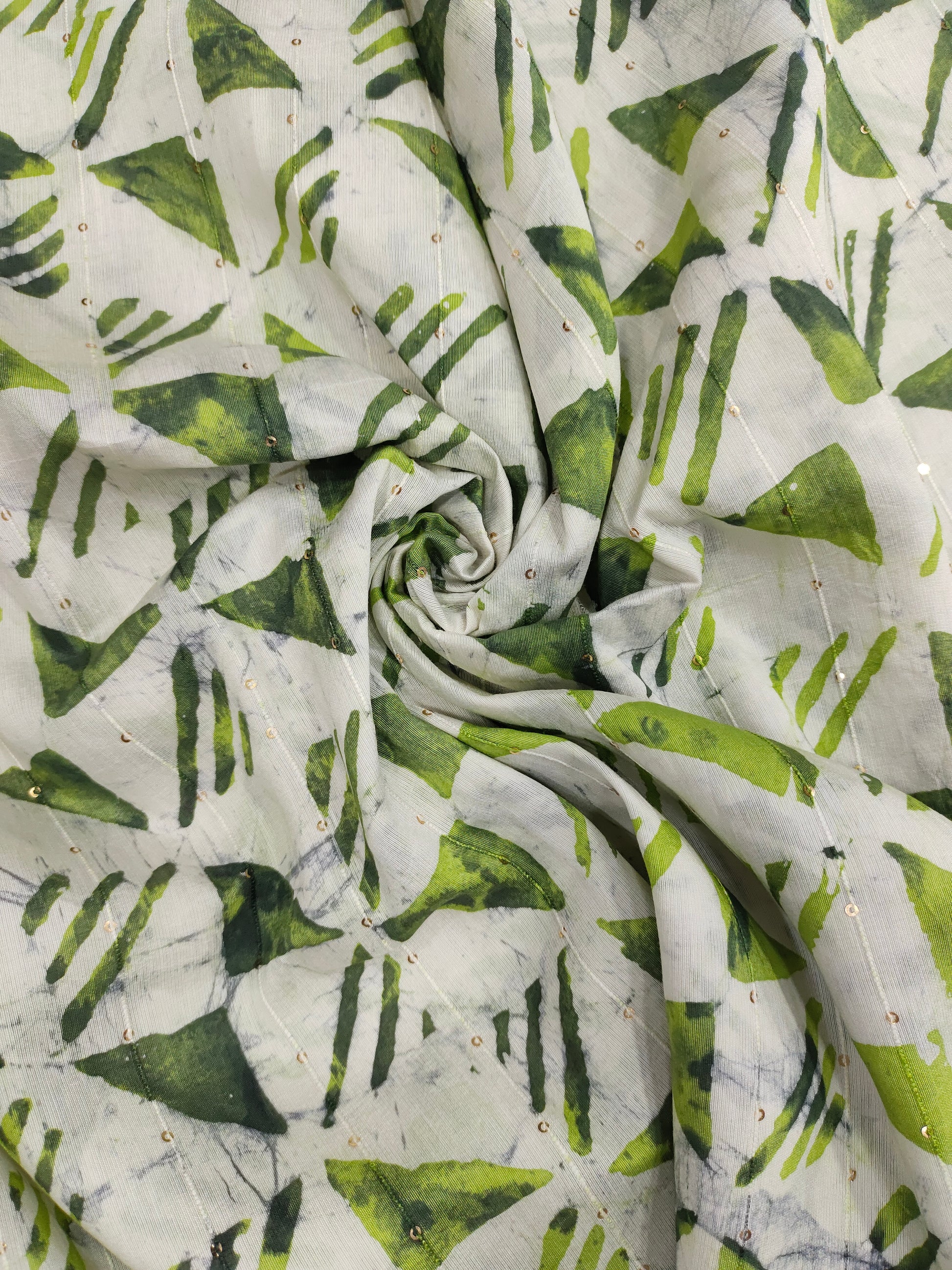 Chanderi silk batiq print with 2 shades of green and gold sequins.