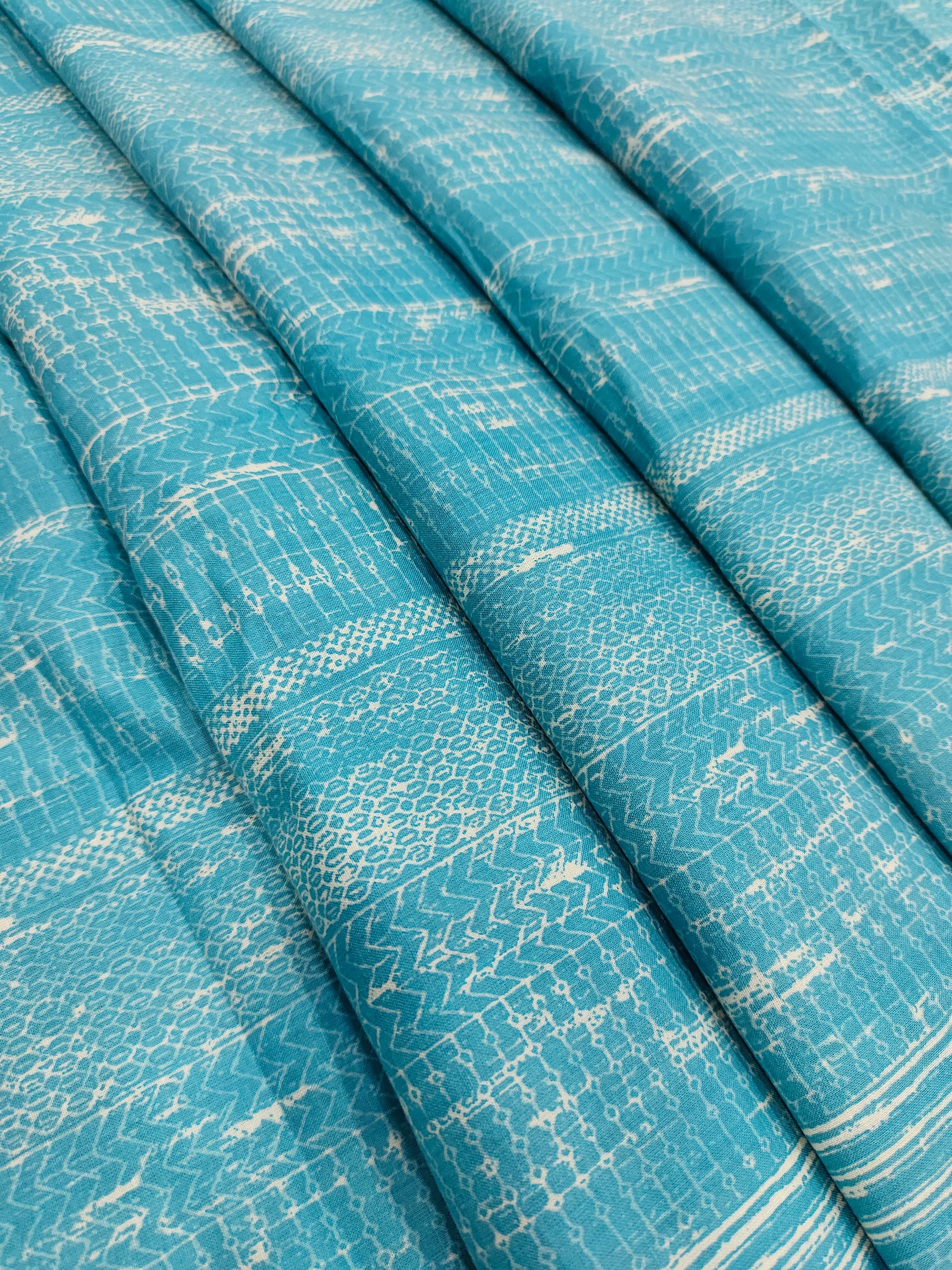 Light peacock blue screen print fabric