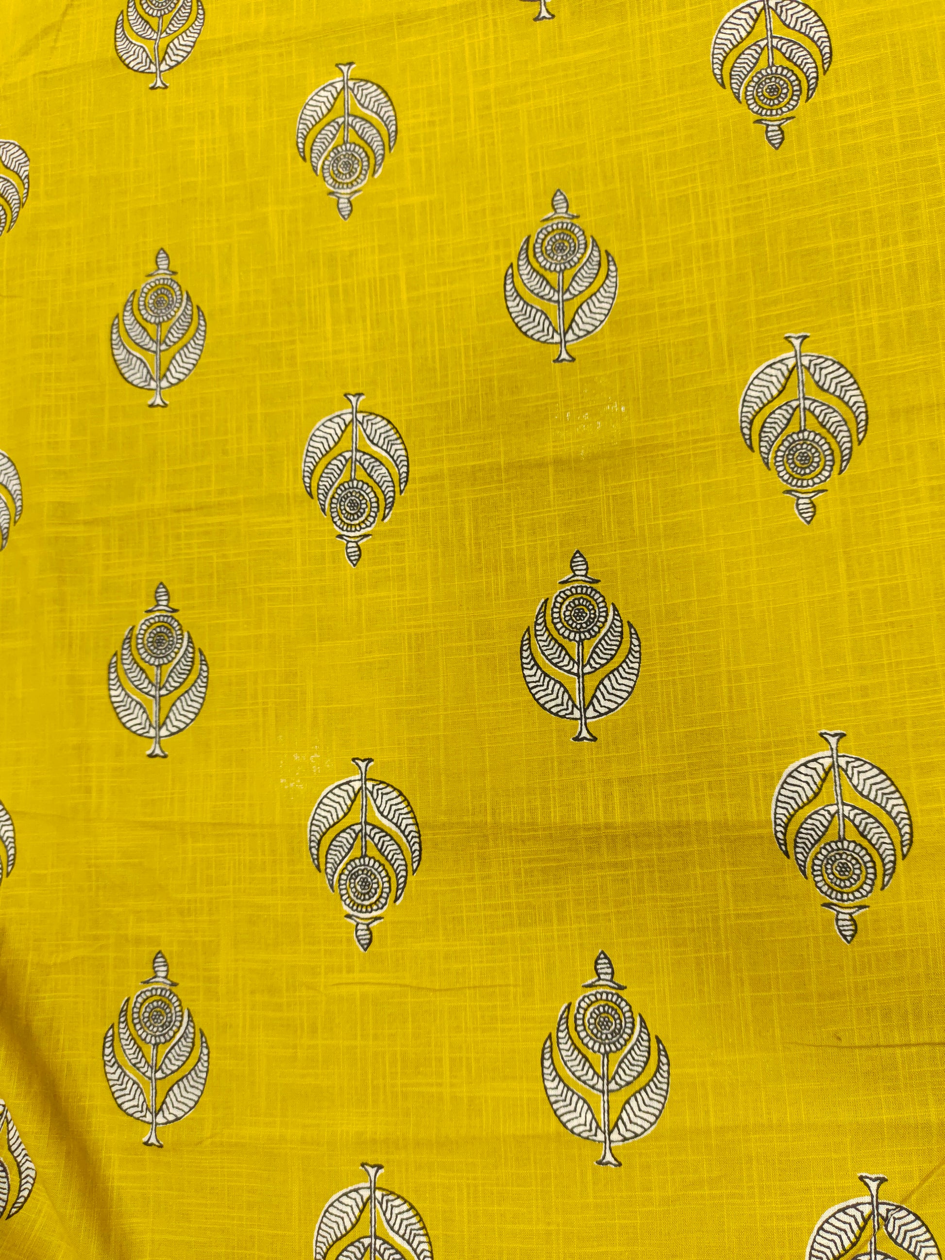 Yellow cotton slub print with black and white motif print.