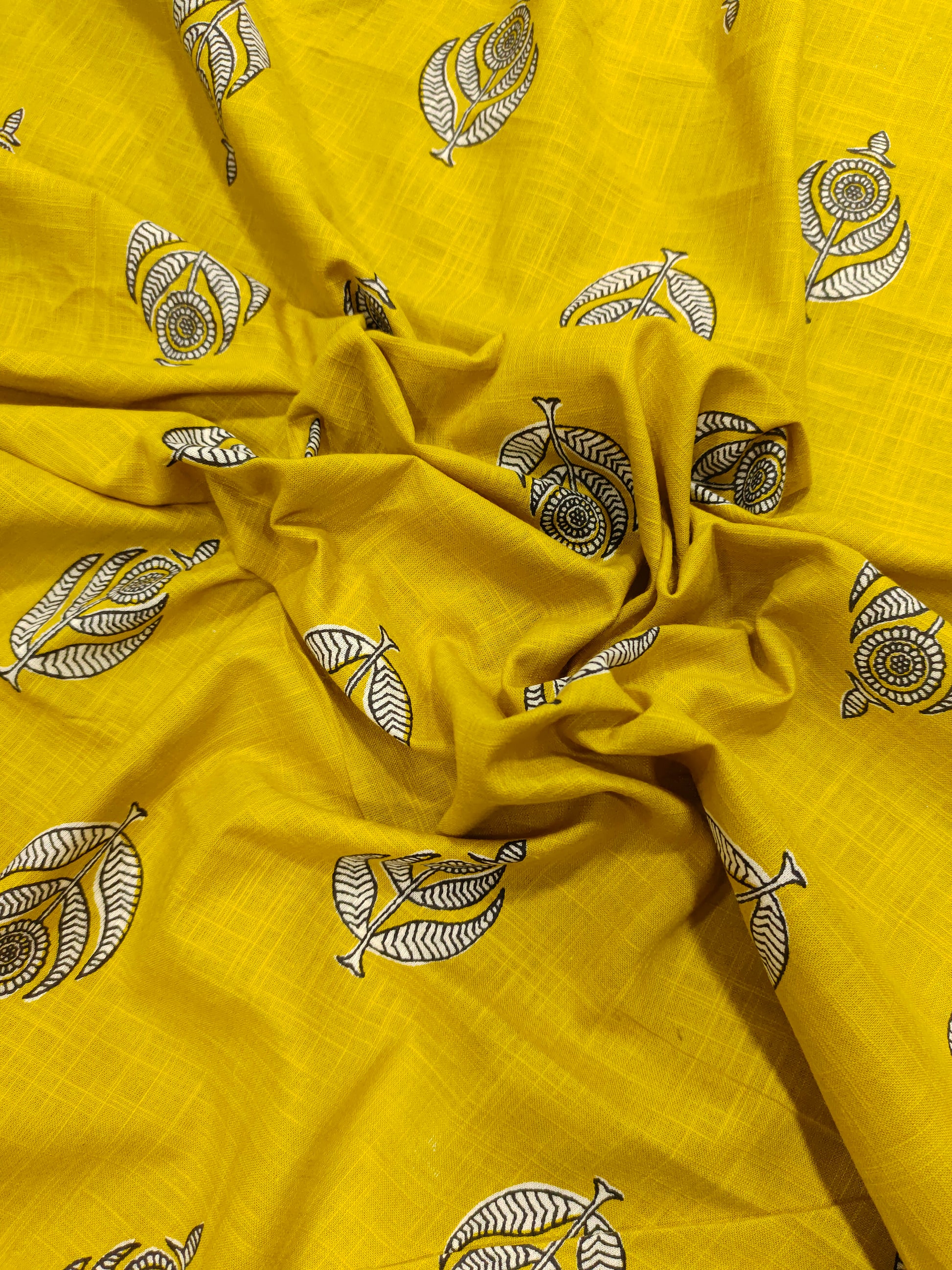 Yellow cotton slub print with black and white motif print.