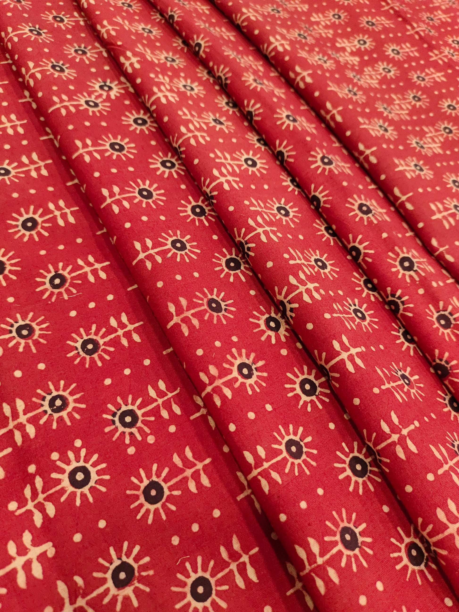 Maroon cotton ajrak print with black and beige.