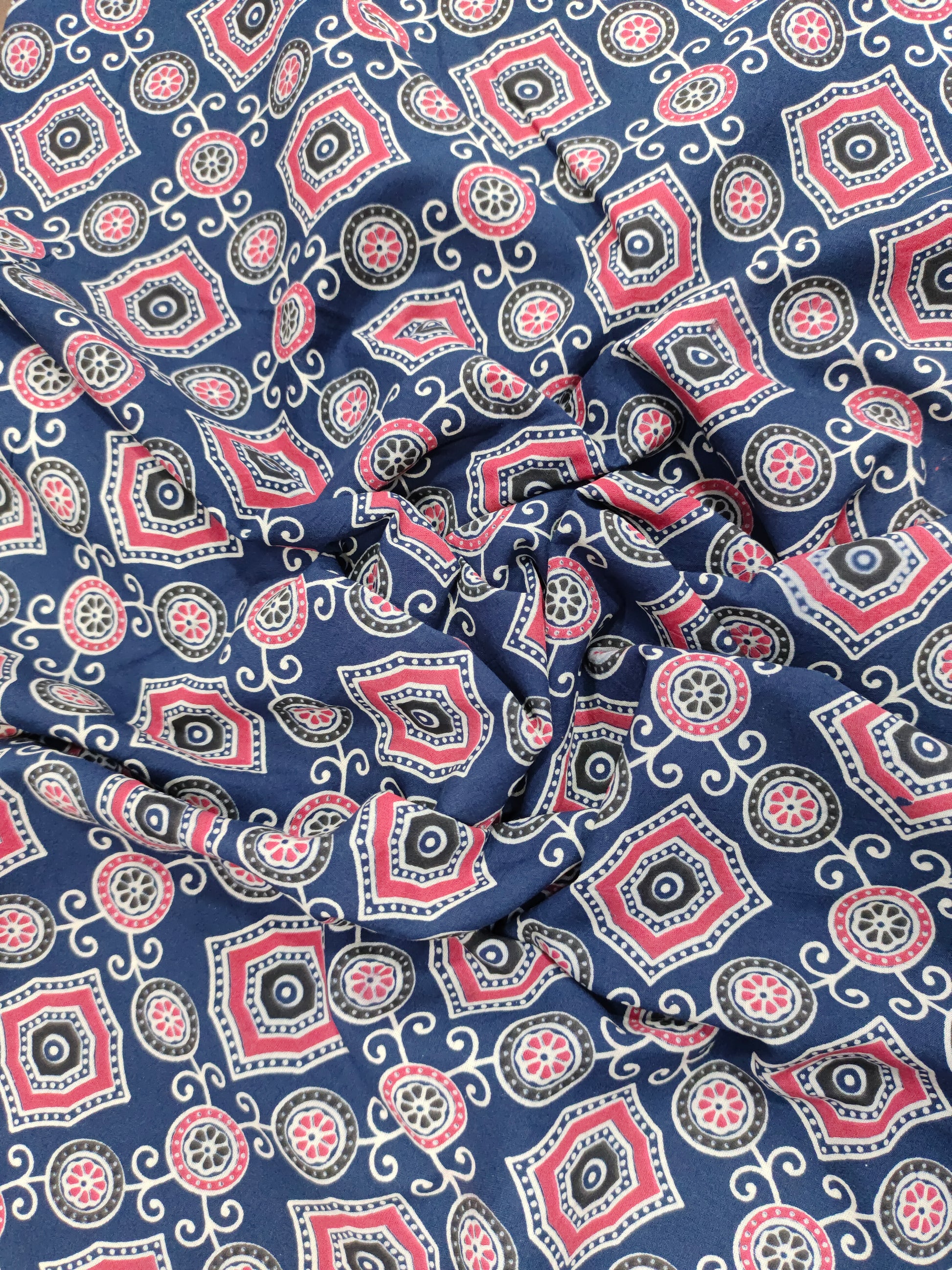 Blue ajrak print allover with red and white.