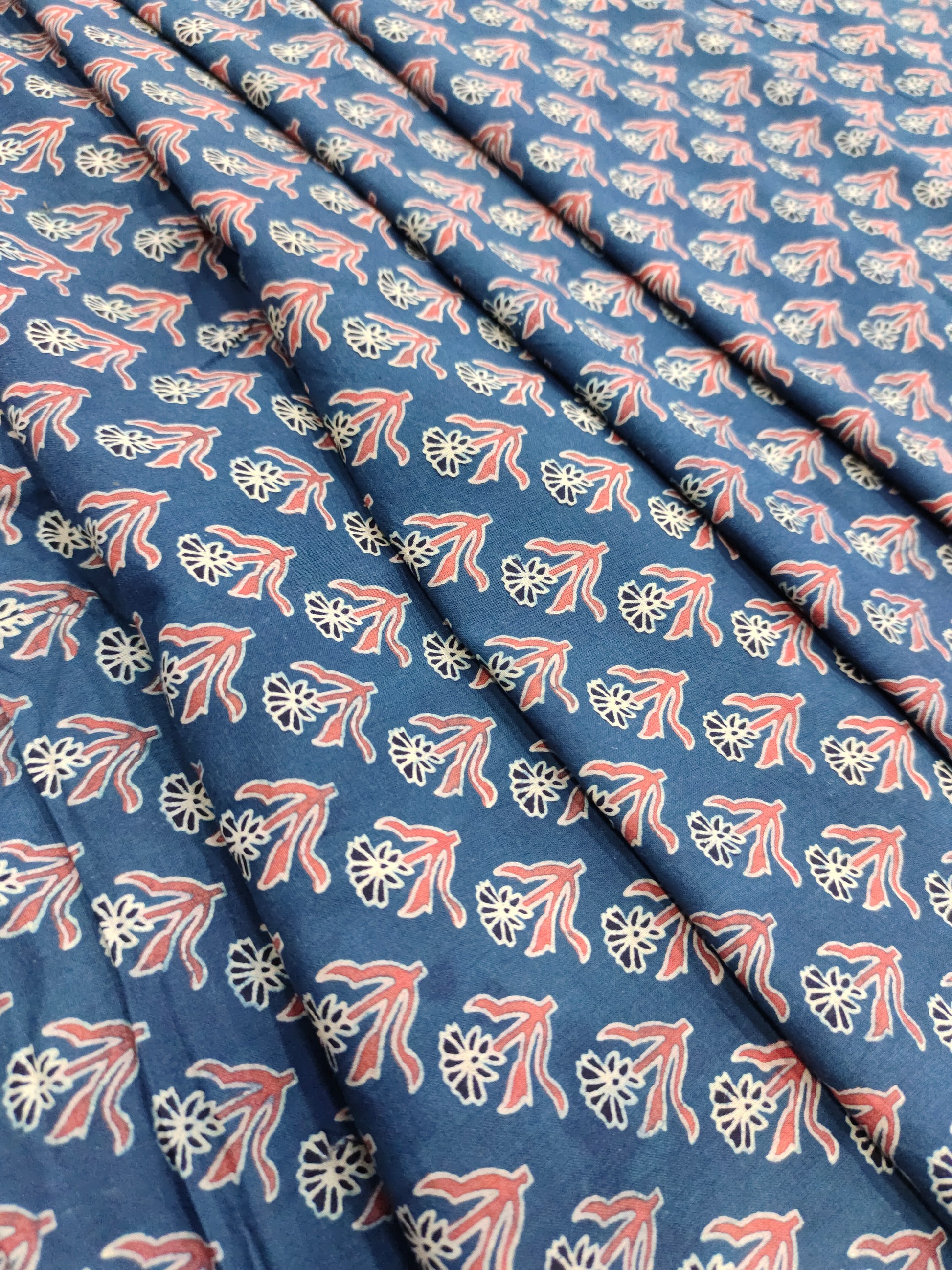 Blue base cotton fabric ajrak print with maroon and offwhite.