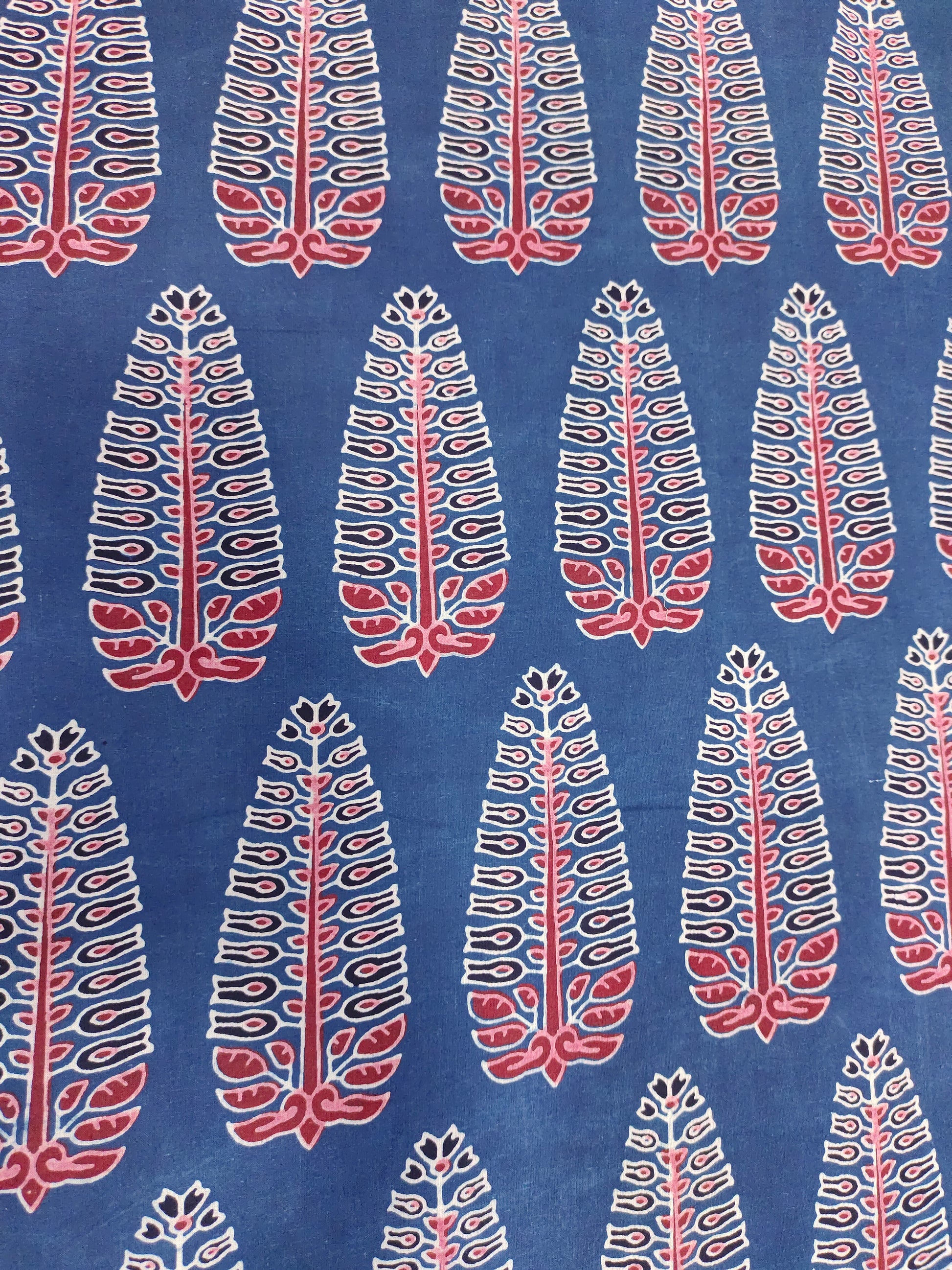 Ajrak print blue fabric with maroon traditional motif print.