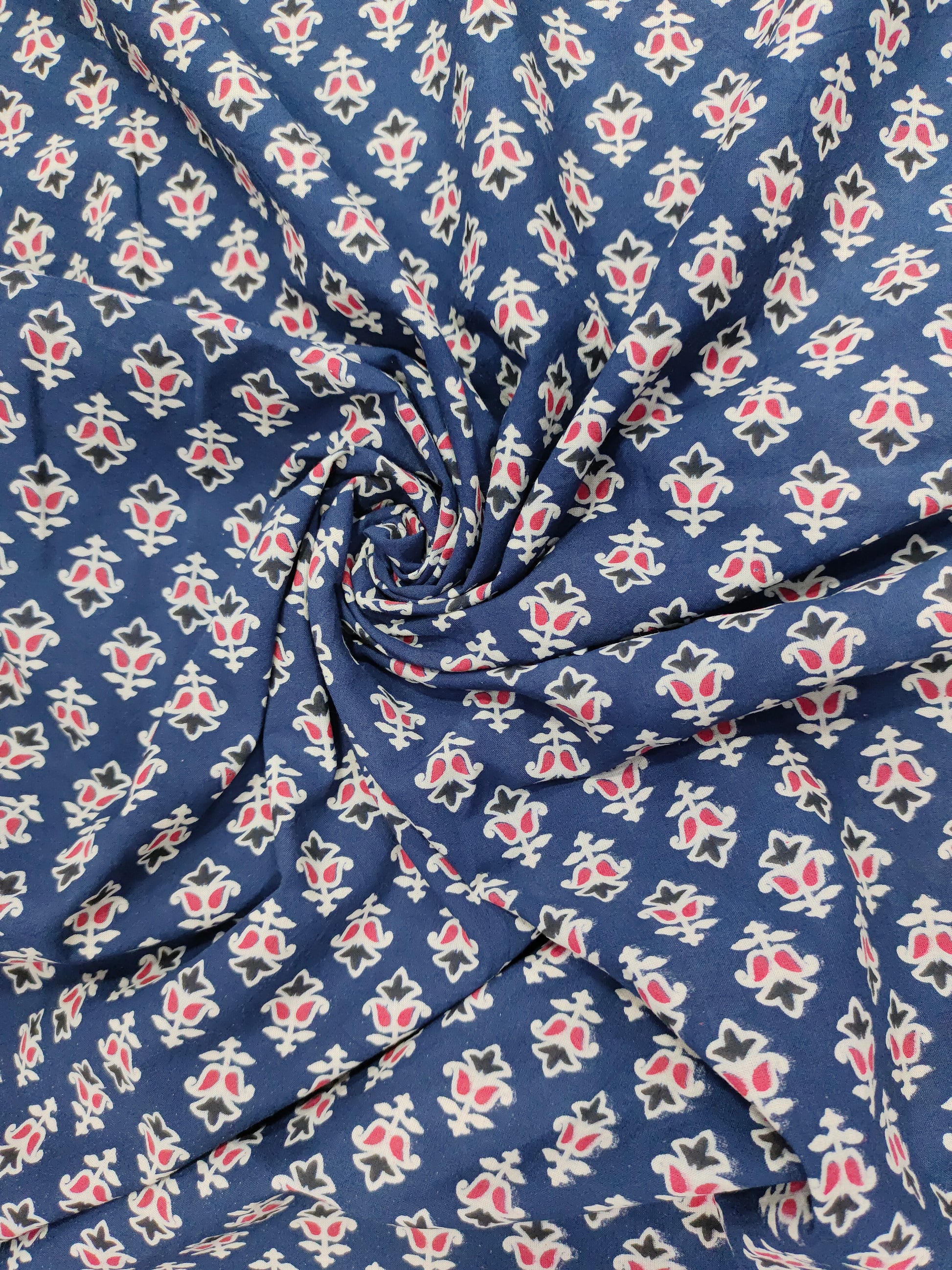 Blue cotton ajrak small butti with red and white.