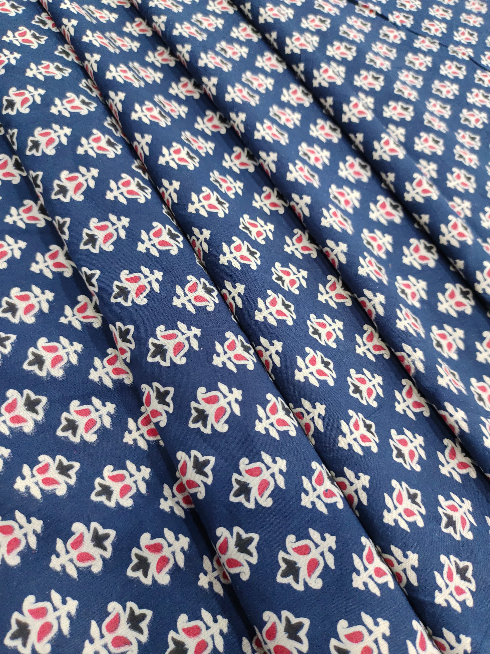 Blue cotton ajrak small butti with red and white.