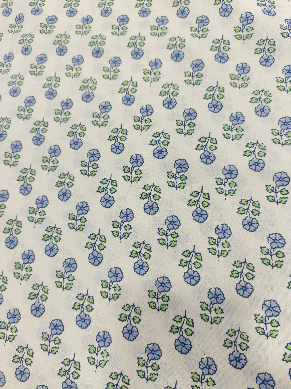 Off white cotton  base fabric with blue print