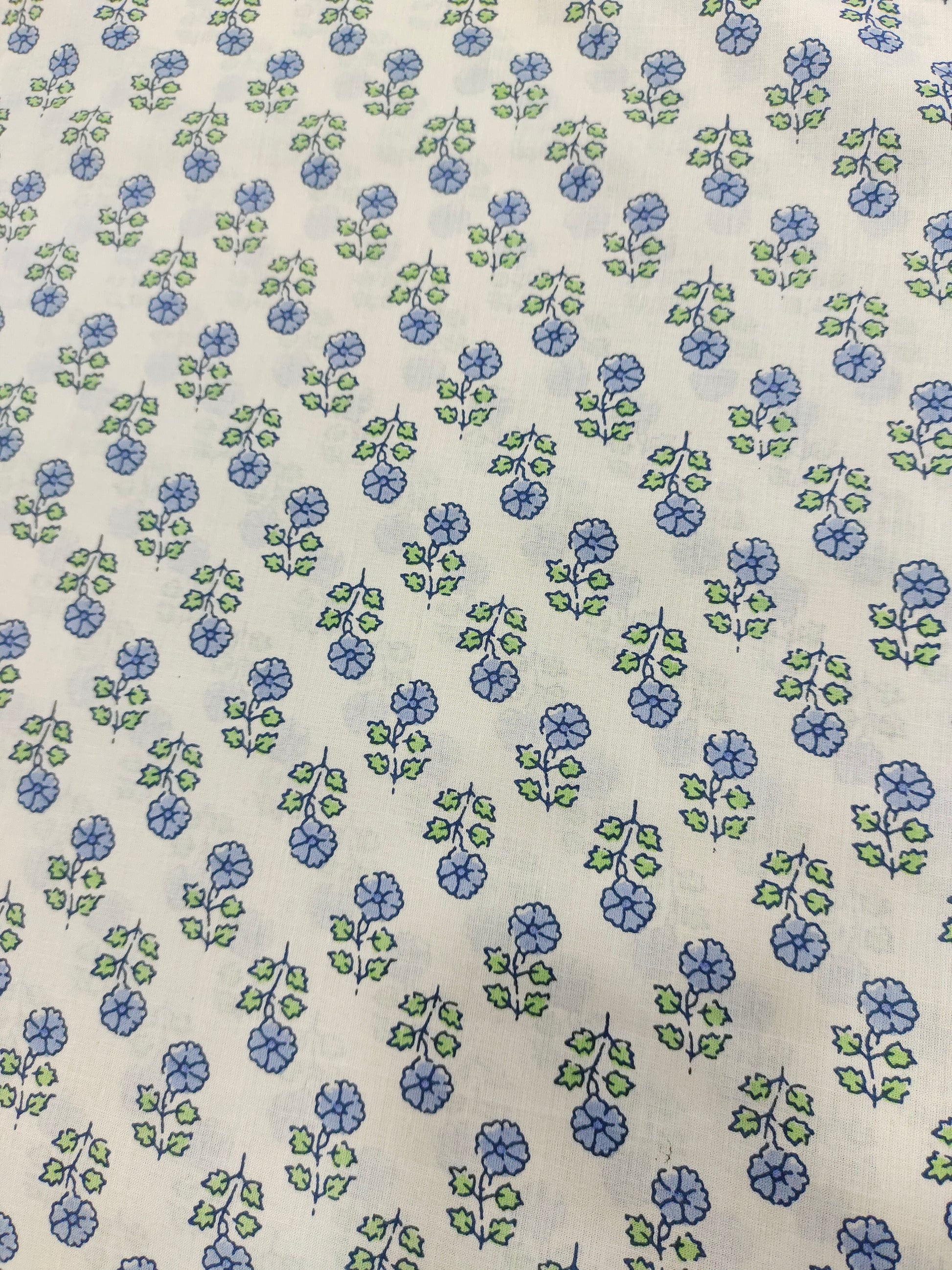 Off white cotton  base fabric with blue print