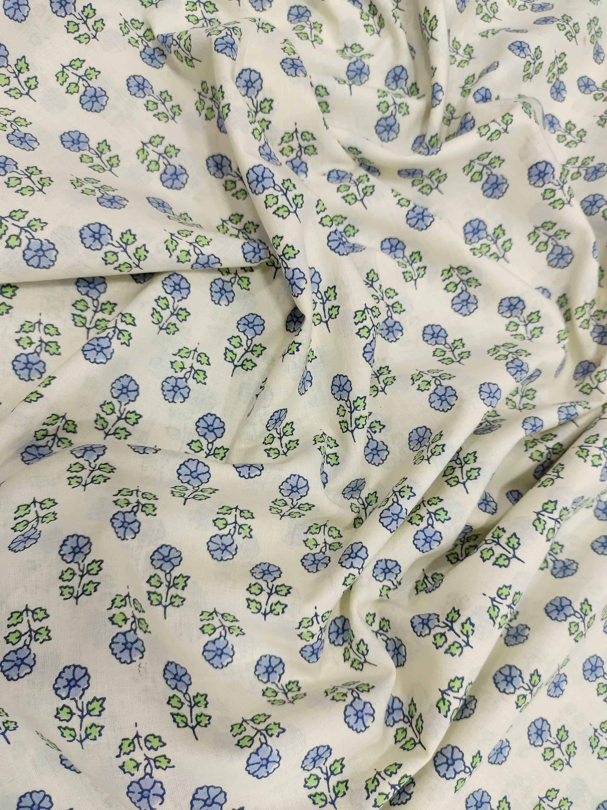 Off white cotton  base fabric with blue print