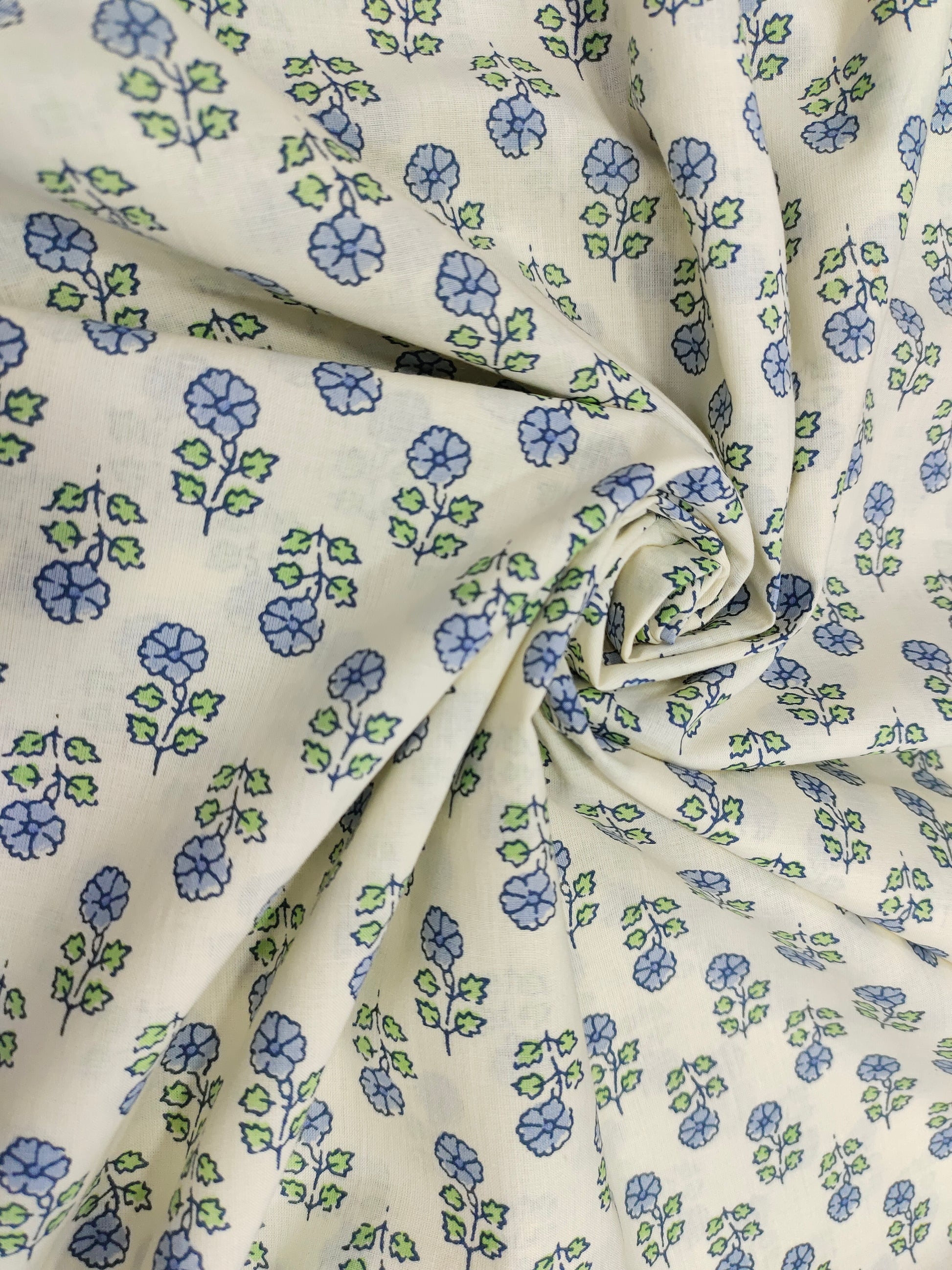 Off white cotton  base fabric with blue print