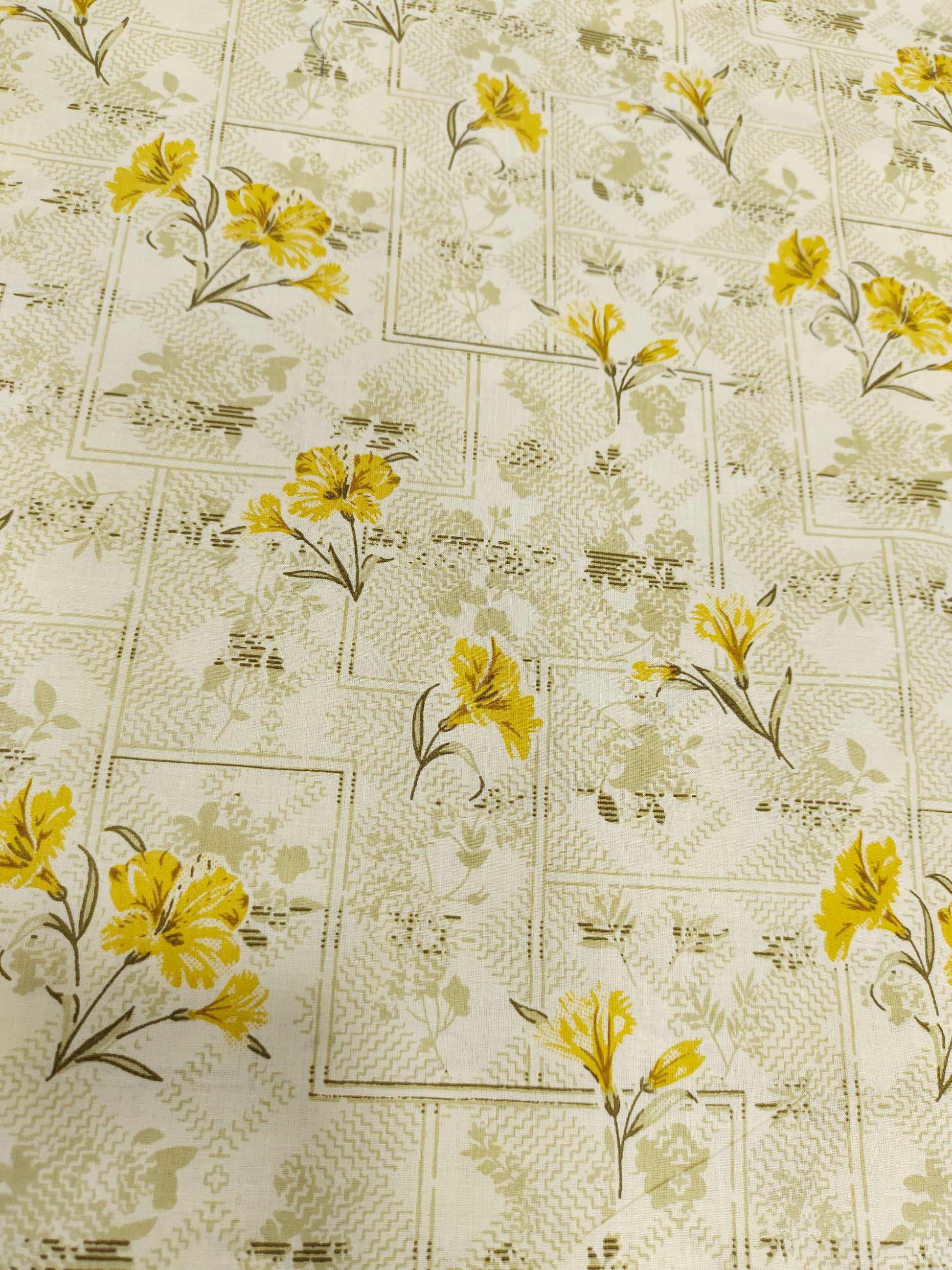 cream base with yellow flowers