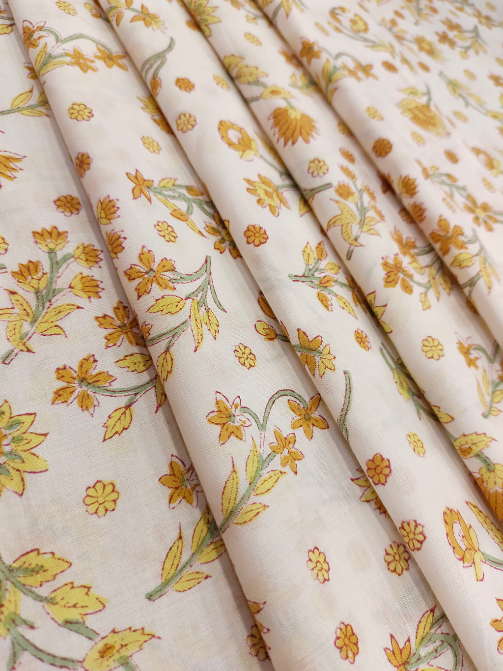 Yellow with mustard flowers on a white base cotton handblock print