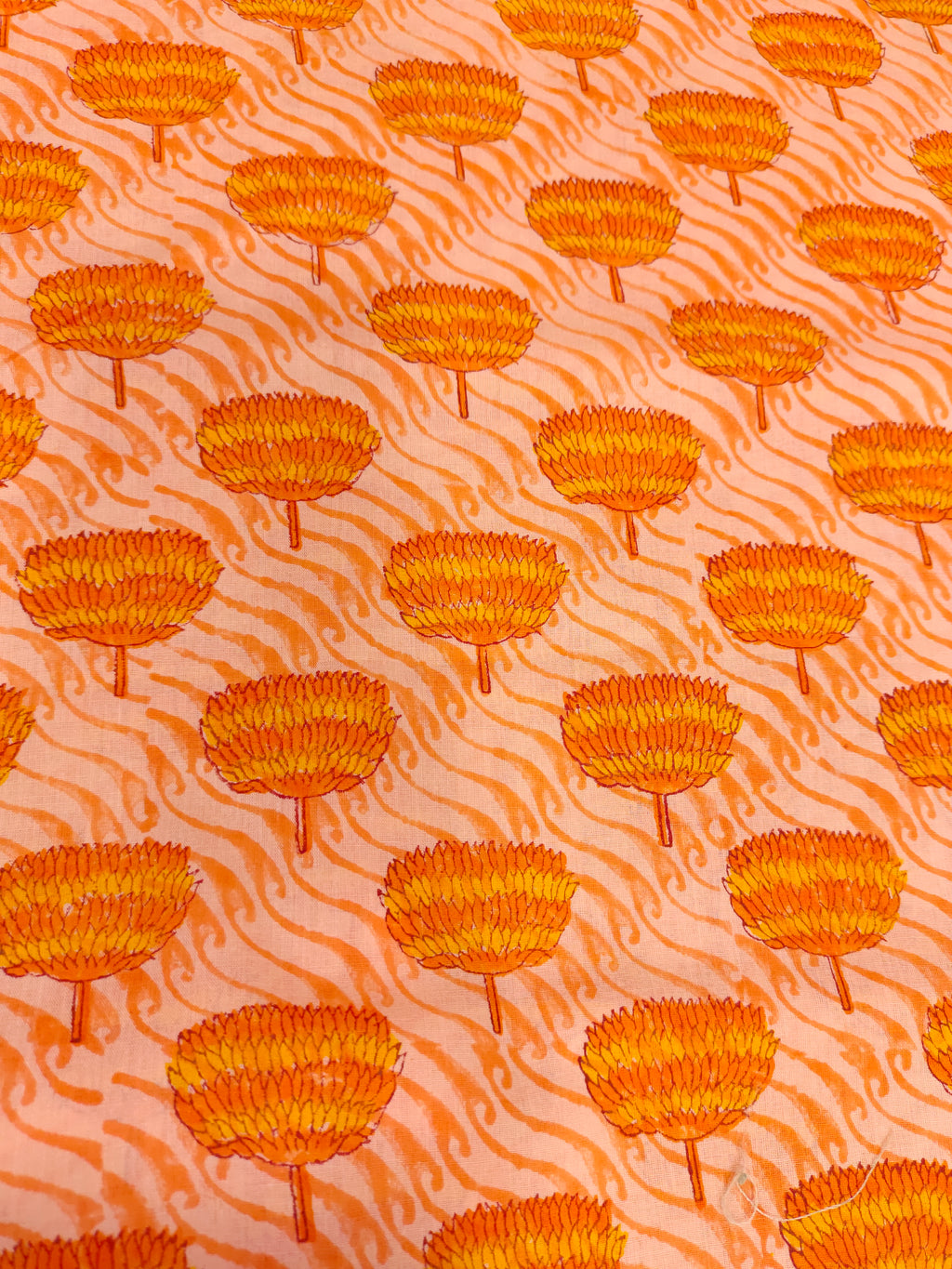 orange handblock print with orange flowers