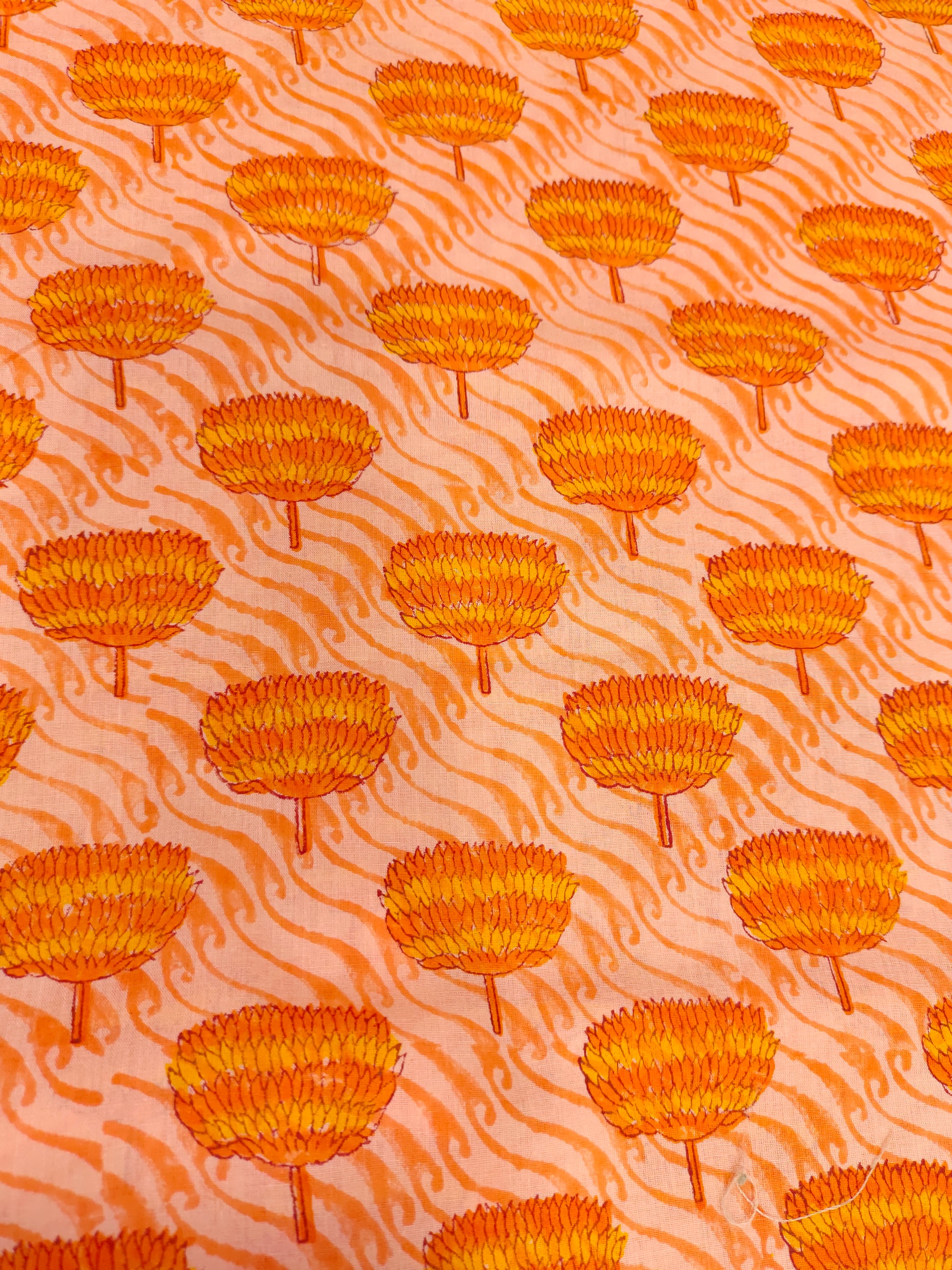 orange handblock print with orange flowers