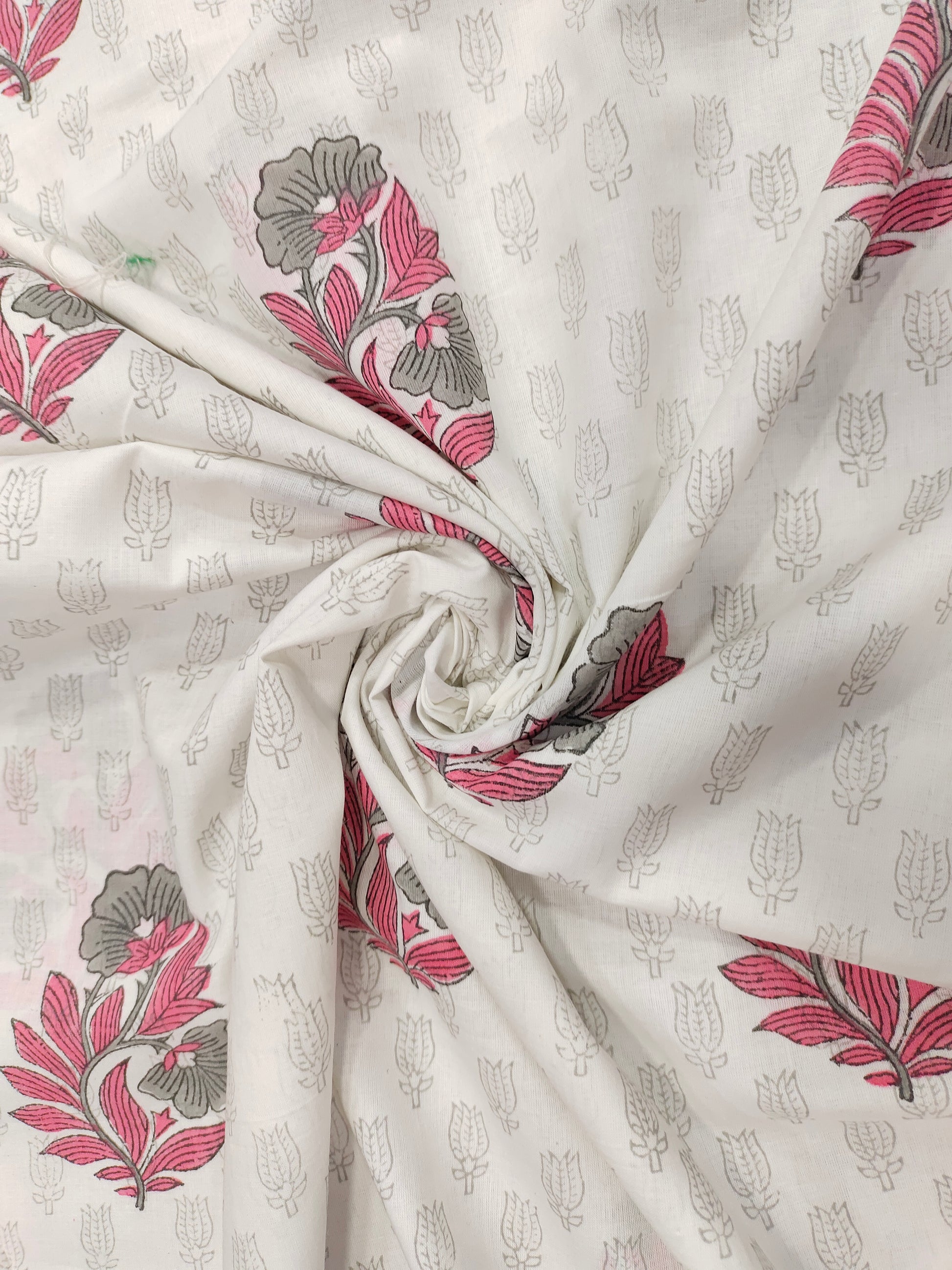 Pink and grey handblock print on white fabric