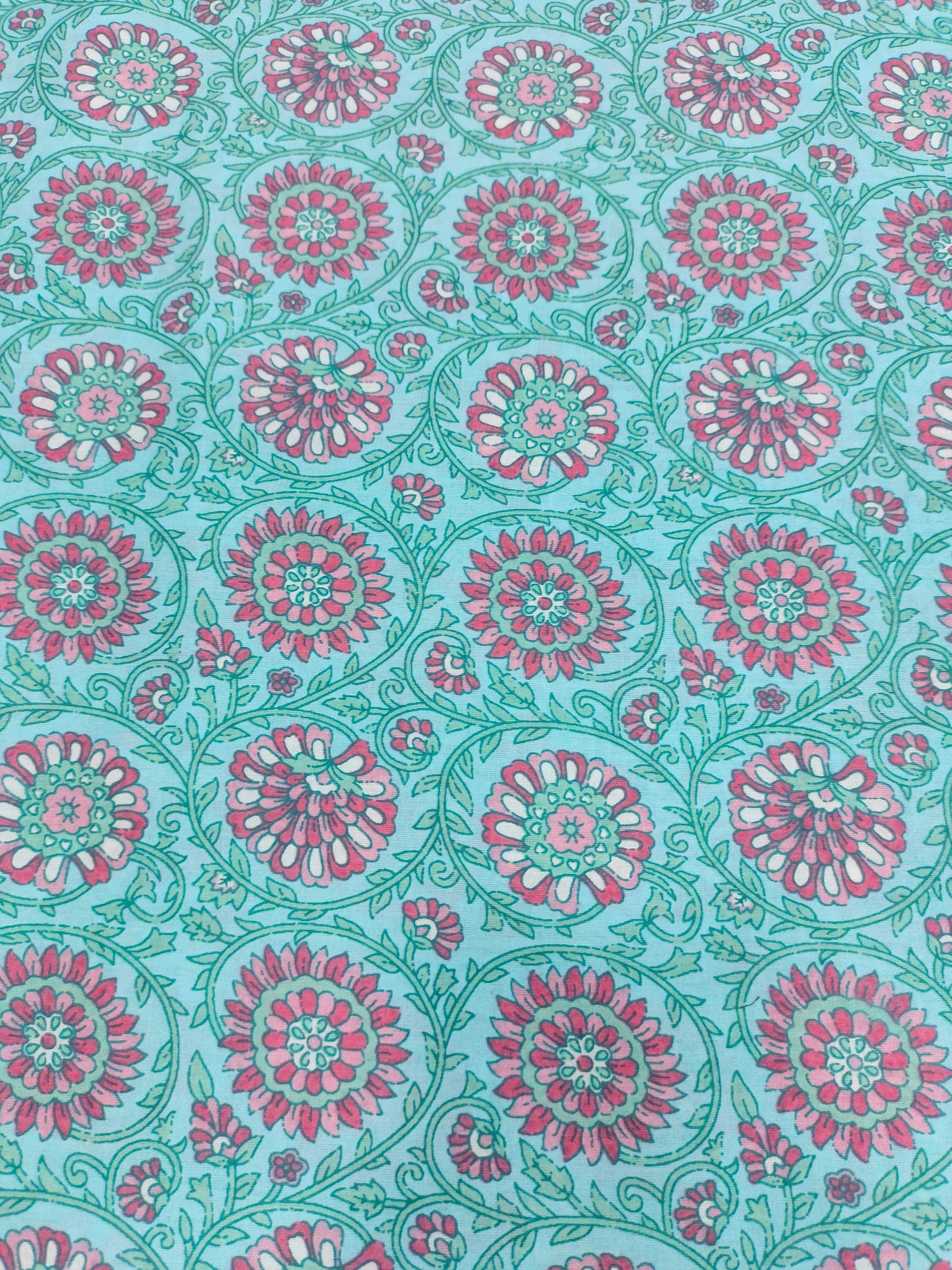 Pink cool floral print on blue fabric