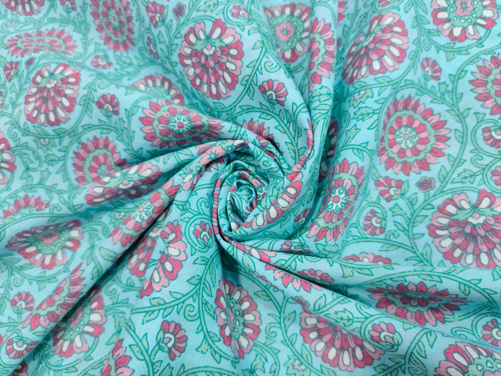 Pink cool floral print on blue fabric
