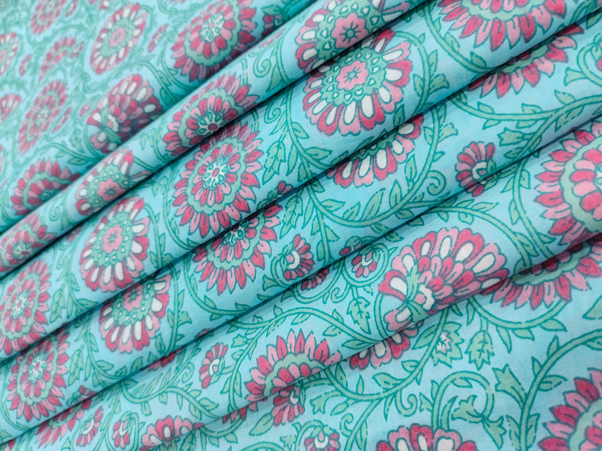 Pink cool floral print on blue fabric